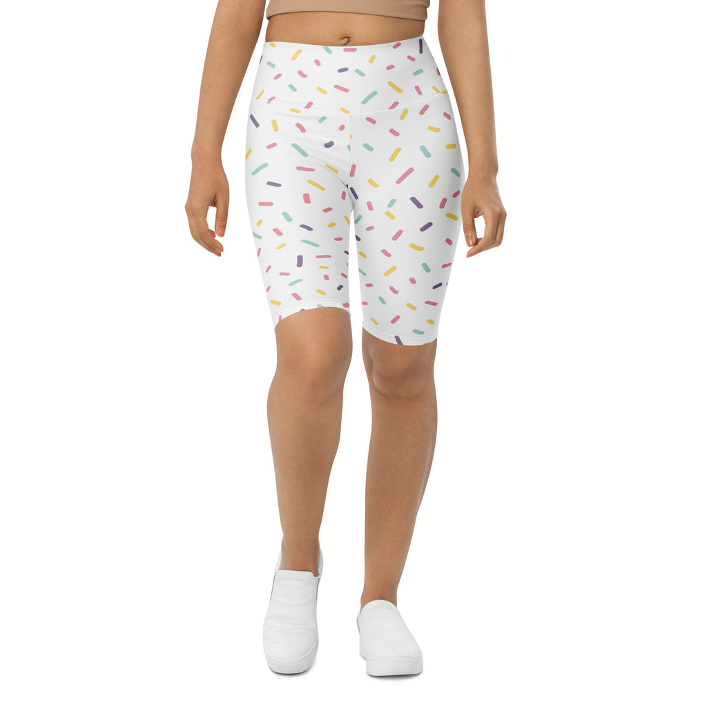 White high waisted bike shorts with a playful multicolored sprinkle print and moisture wicking active fit