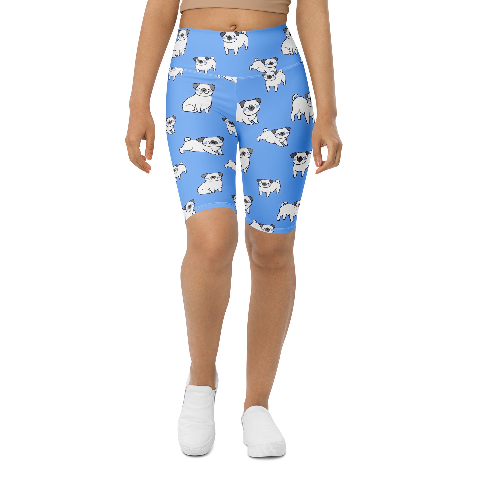 Women’s blue pug high waisted bike shorts with moisture wicking fabric and playful white cartoon pug pattern