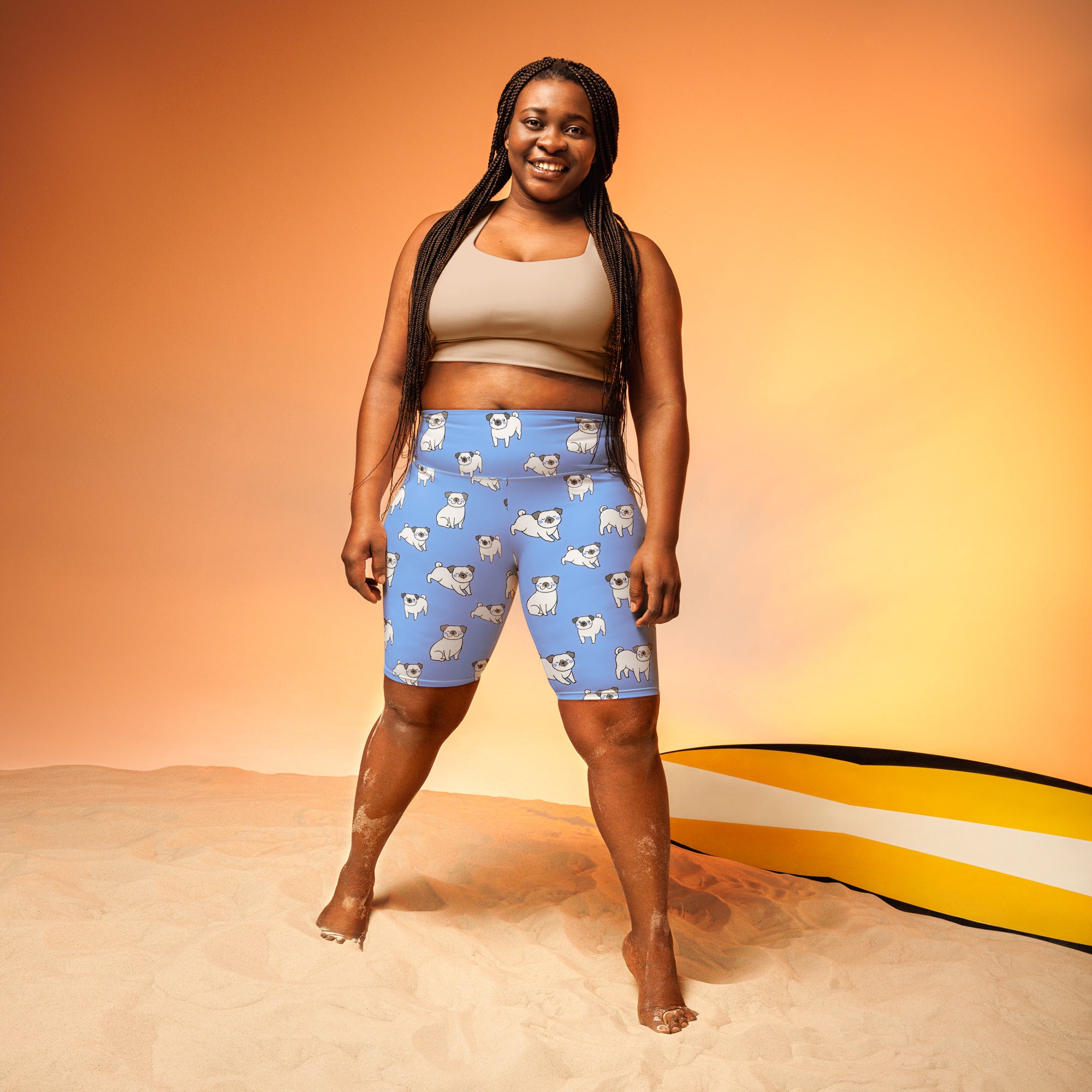 Women’s blue pug high waisted biker shorts with moisture wicking fabric featuring a playful white pug pattern
