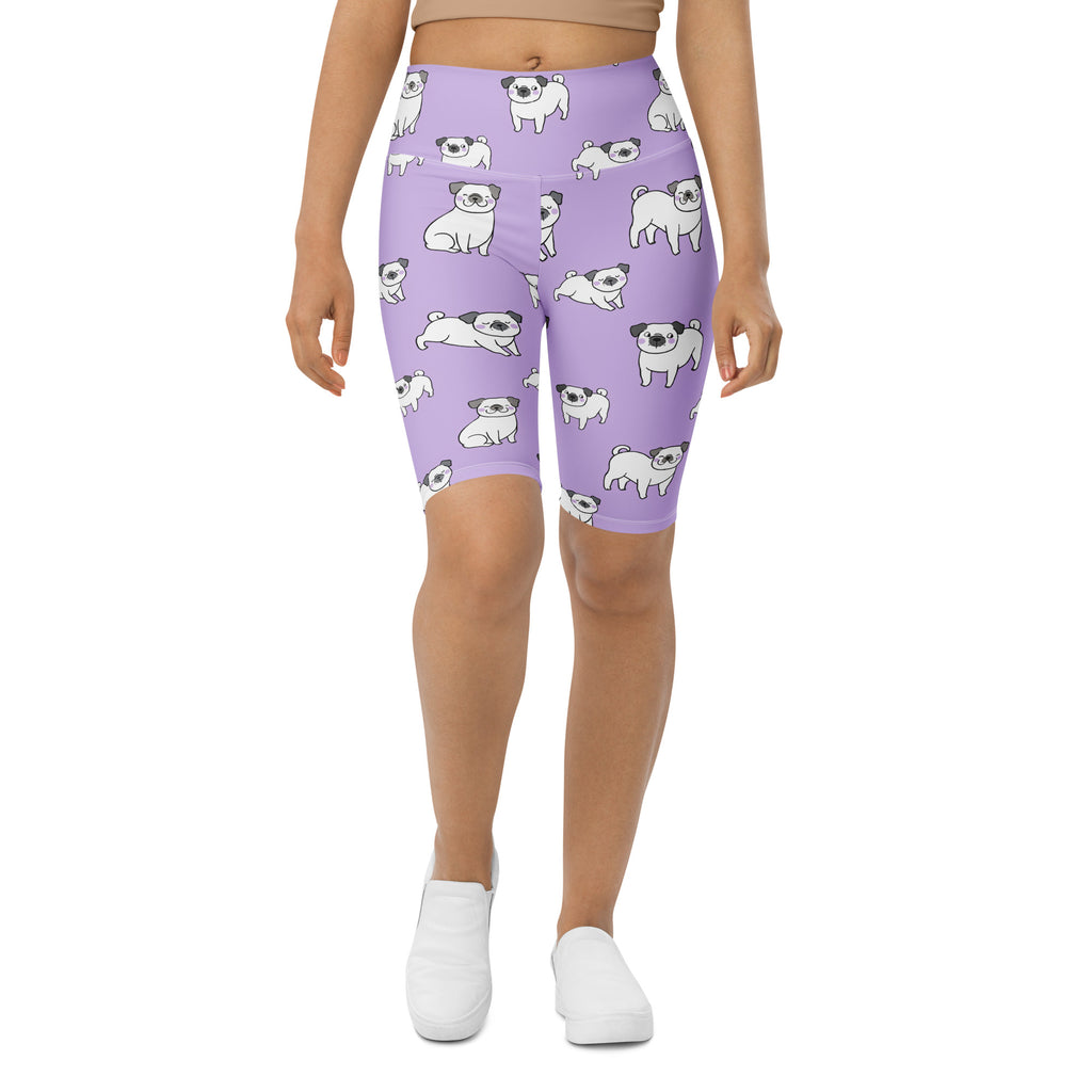 Women’s purple high waisted moisture wicking bike shorts with a playful pattern of white pugs and black accents