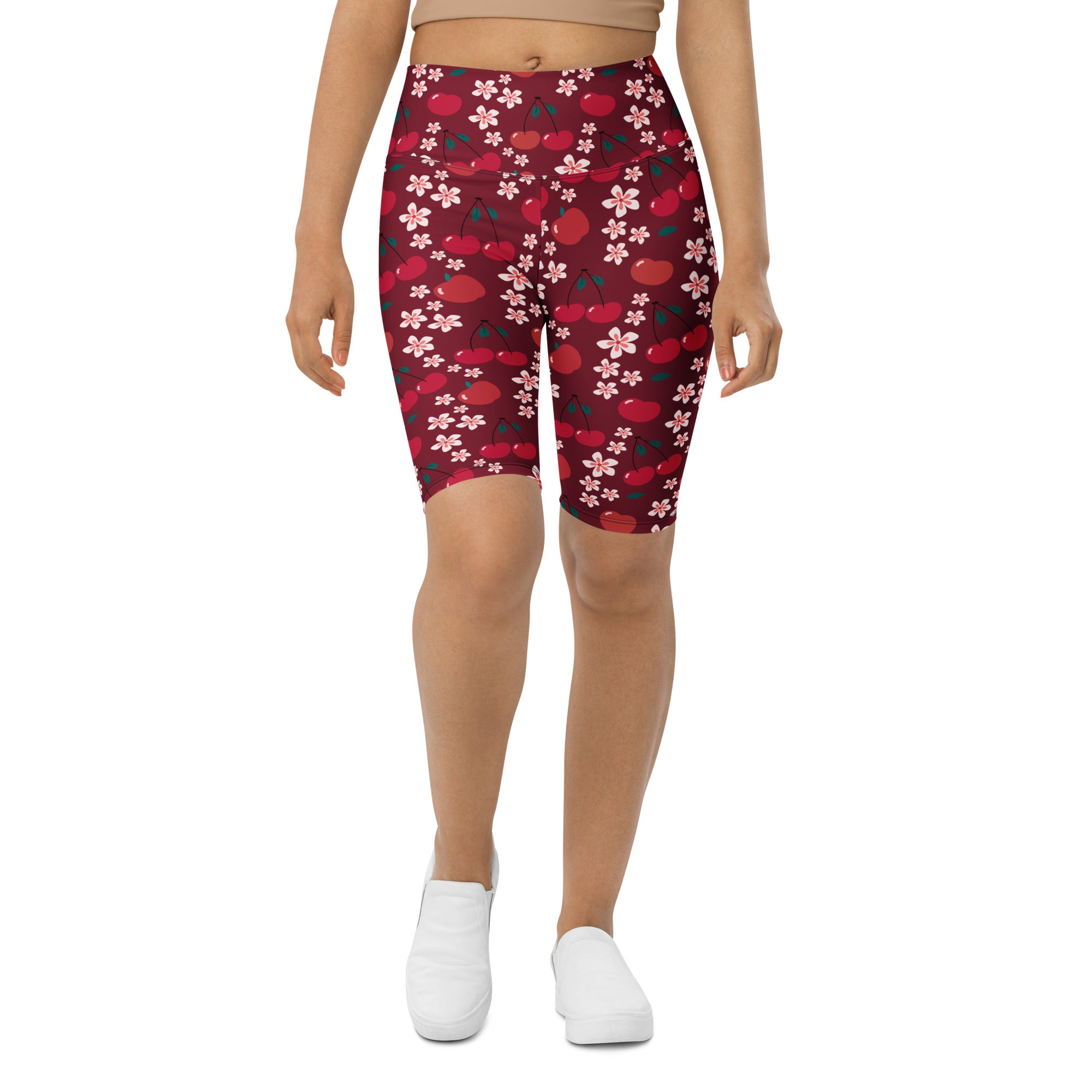 Women’s burgundy high waisted bike shorts with red cherry and pink flower pattern moisture wicking active fit