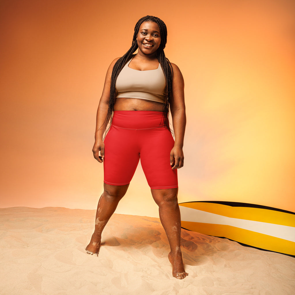 Women’s red high waisted biker shorts made of moisture wicking fabric for an active fit fitness look