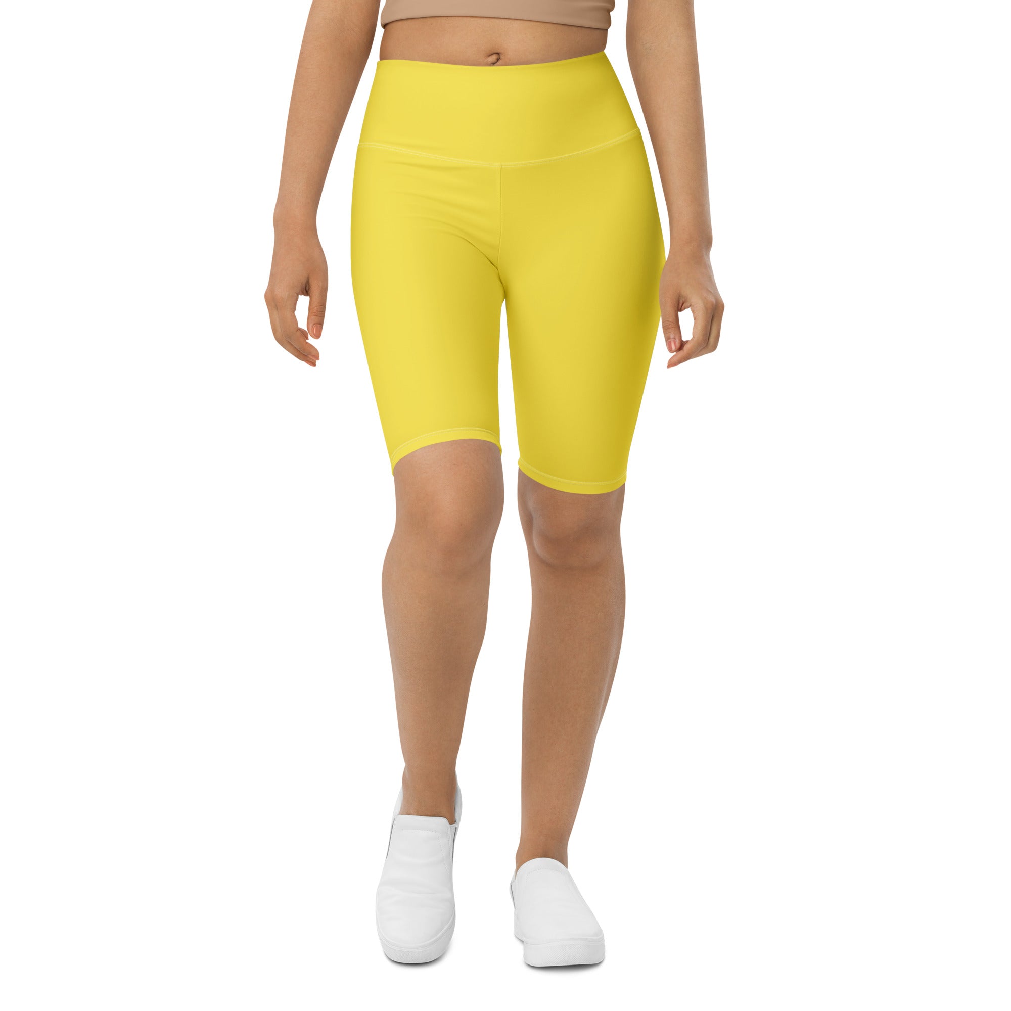 Bright yellow women’s high waisted bike shorts with moisture wicking fabric for active fit use