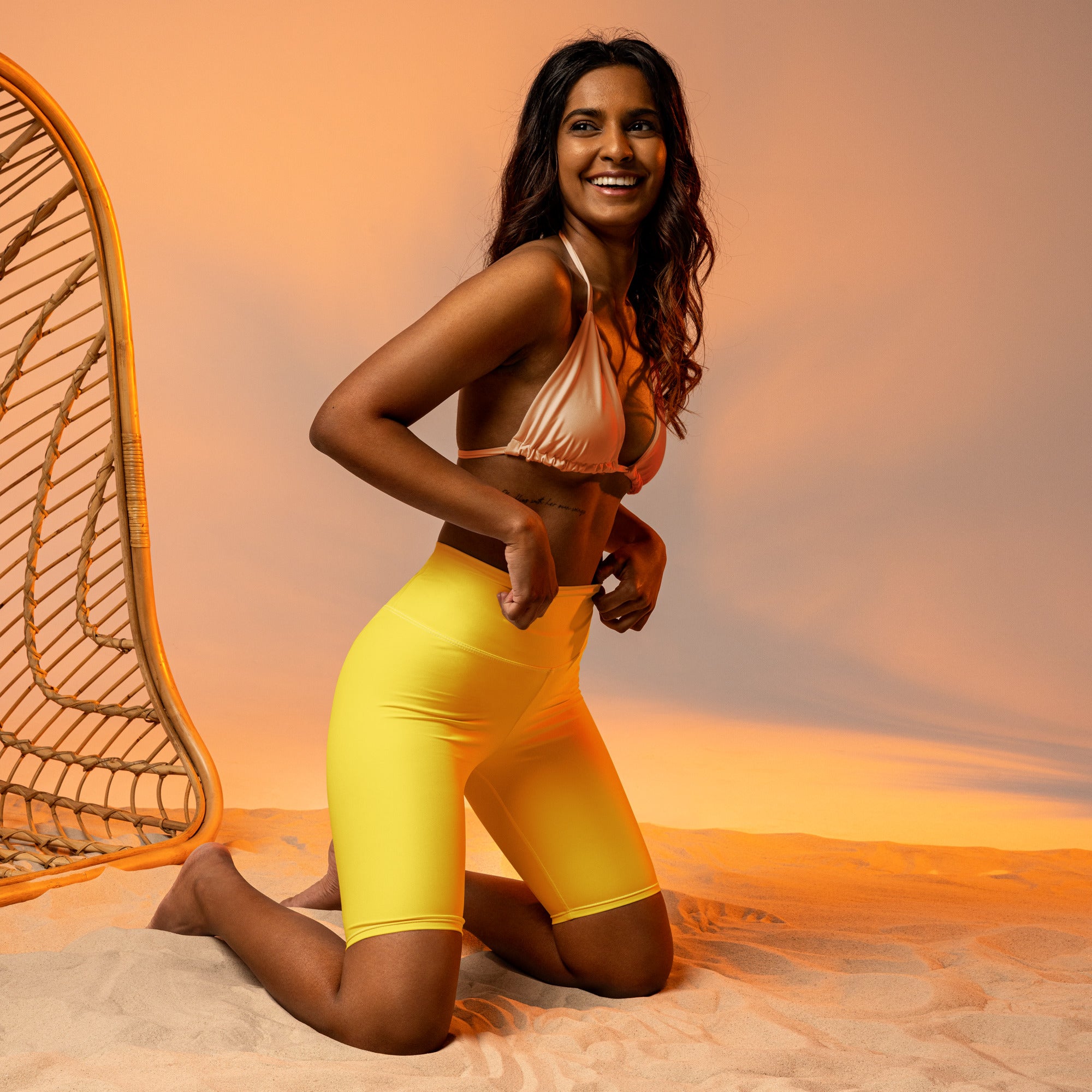 Women’s yellow high waisted biker shorts with smooth stretchy moisture wicking fabric for active fit
