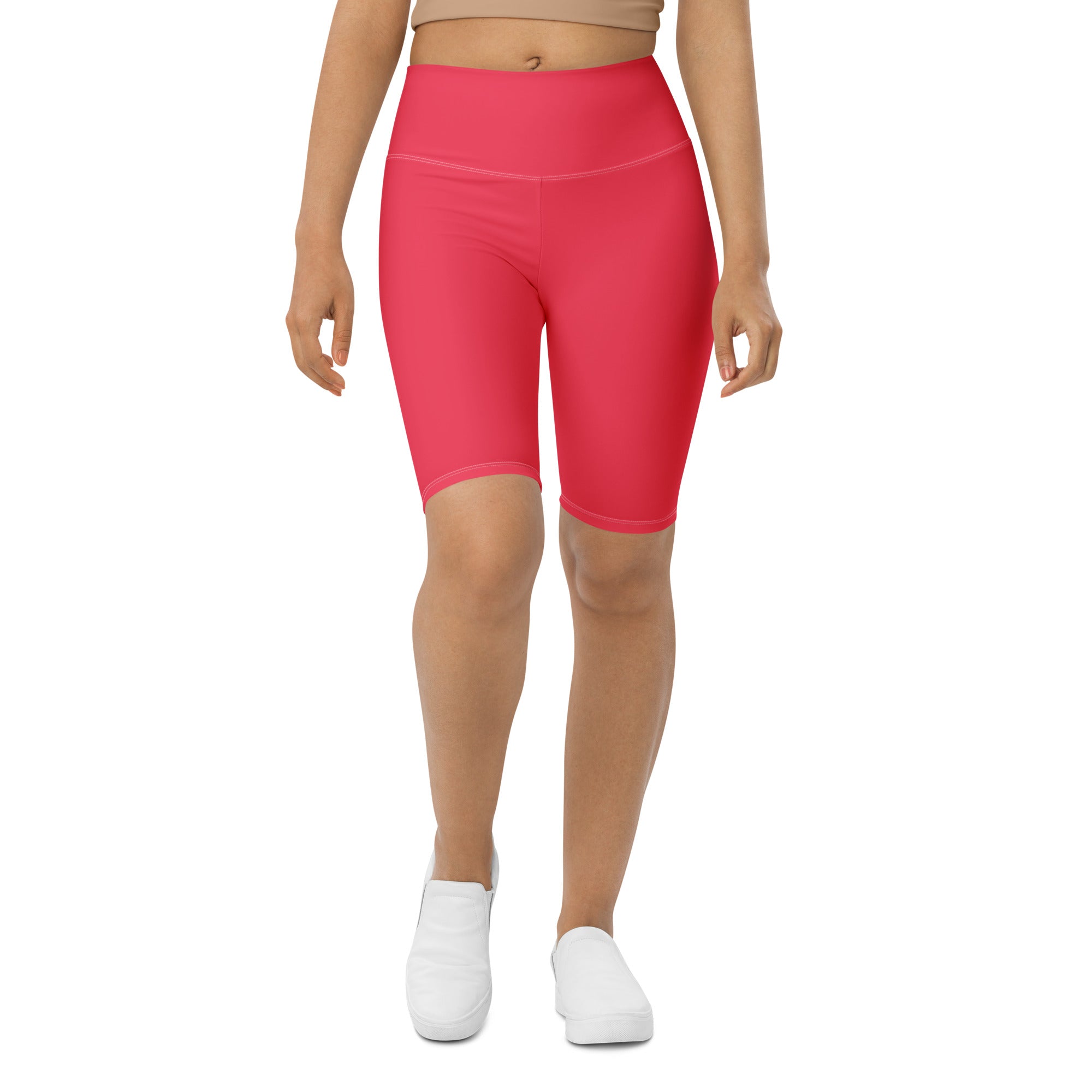 Bright pink high waisted bike shorts made of stretchy moisture wicking fabric for active women’s fit