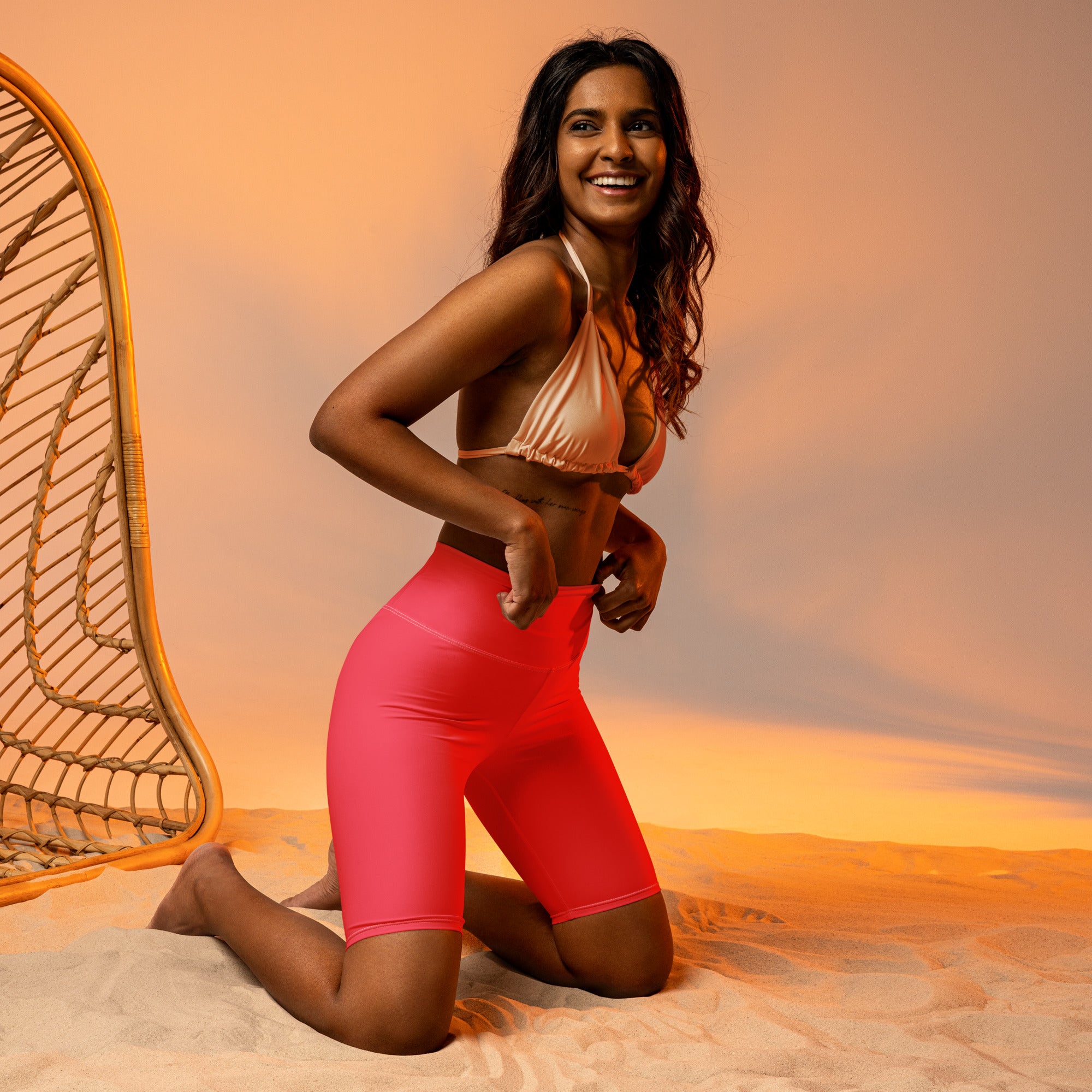 Women’s bright pink high waisted biker shorts with moisture wicking fabric for active fit and comfort