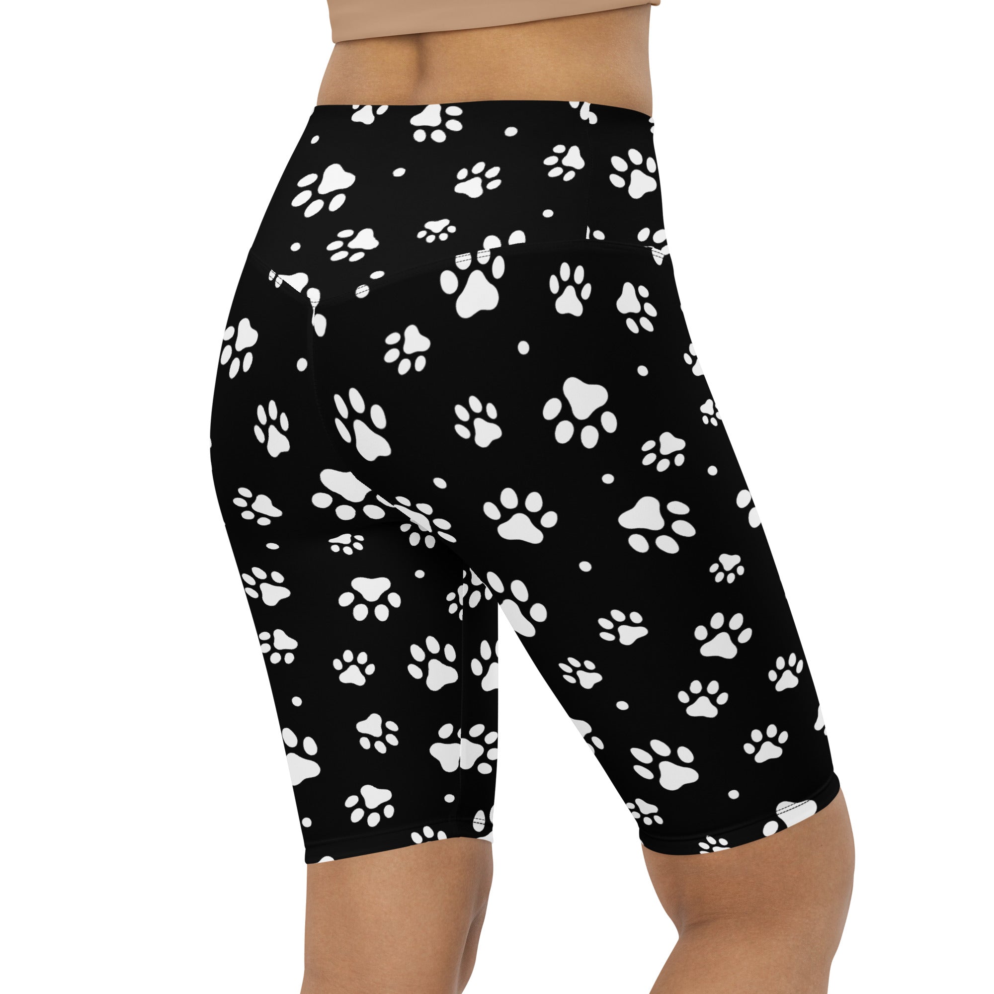 Black high waisted bike shorts with white paw print pattern moisture wicking active fit for women