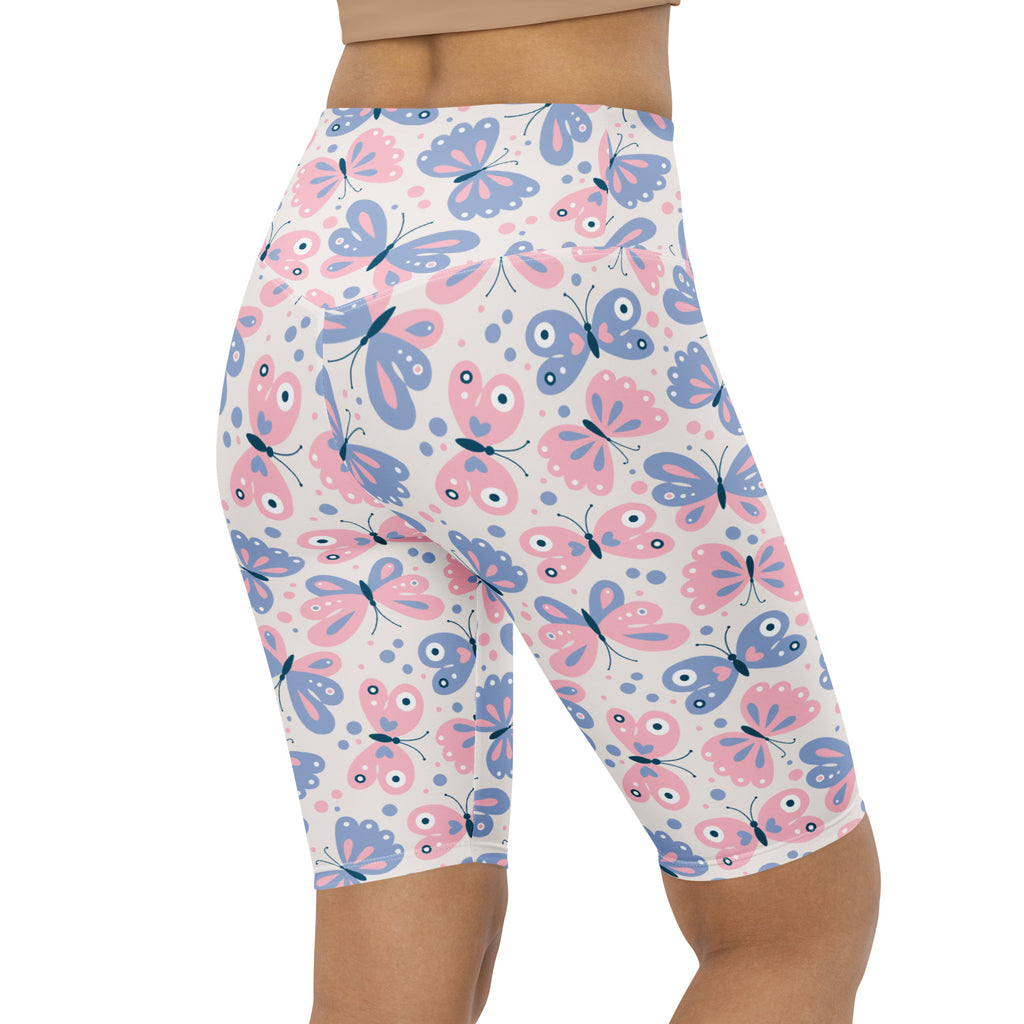 Women’s butterfly print high waisted biker shorts in pink and blue with moisture wicking active fit material