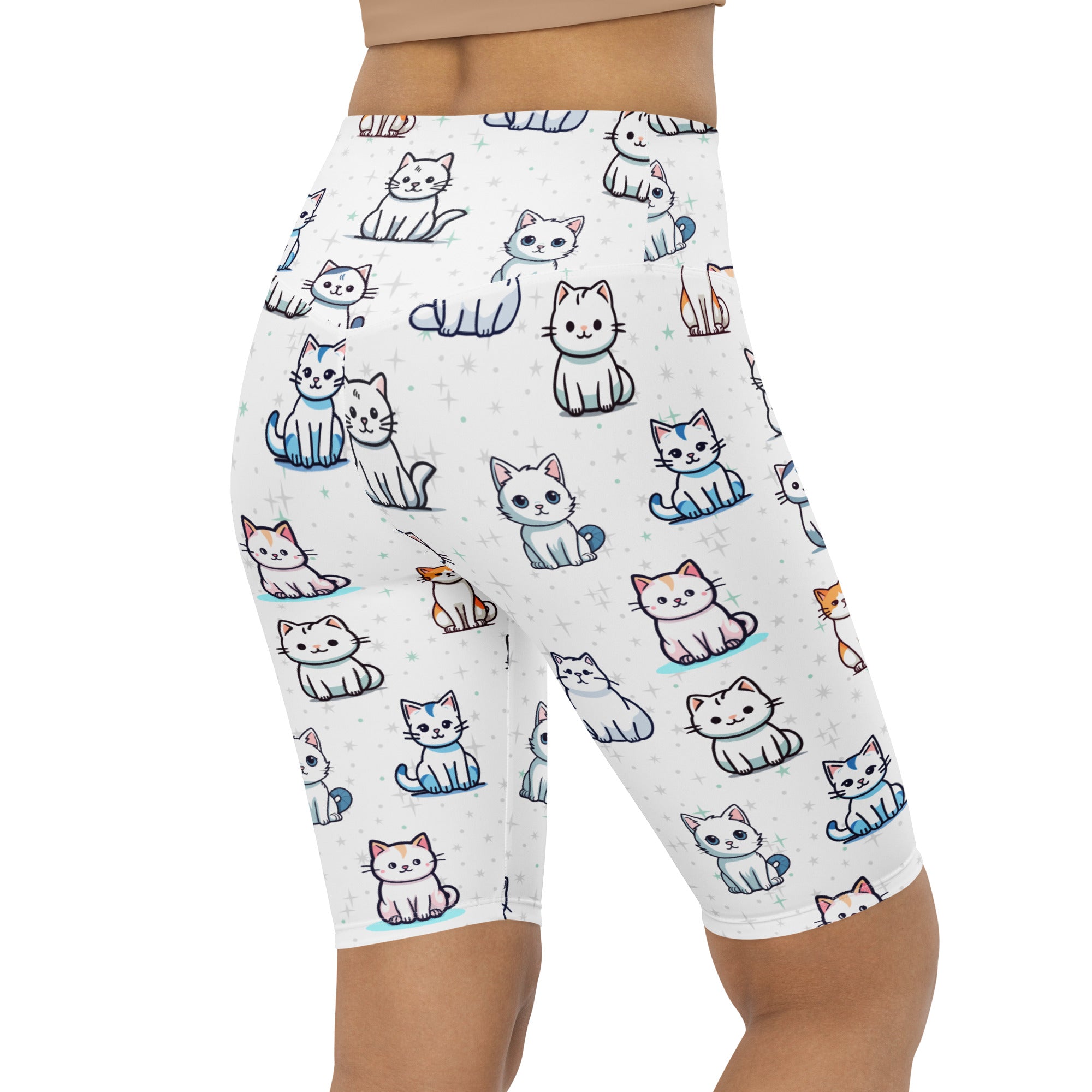 White high waisted bike shorts with moisture wicking fabric featuring cartoon cats in white blue orange and pink