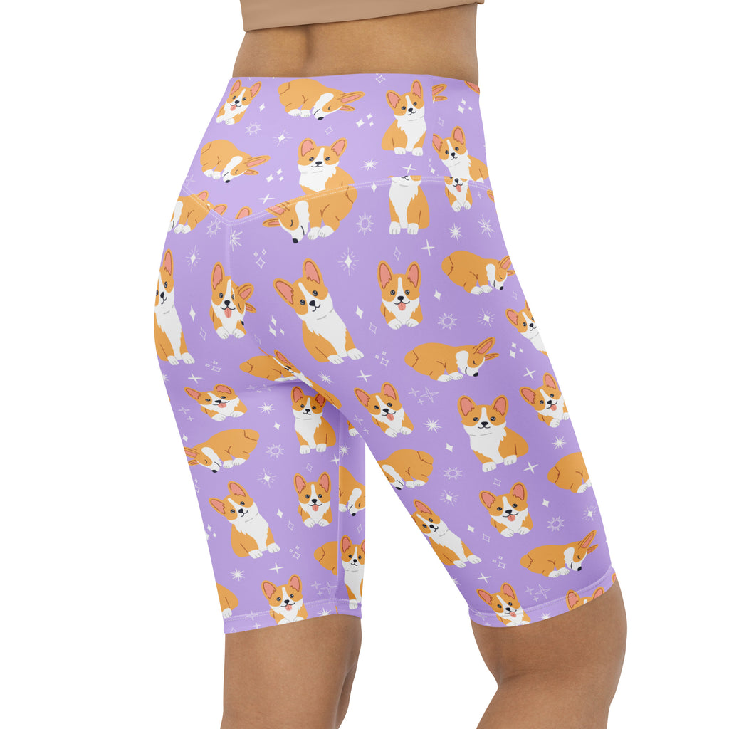 Women’s purple high waisted moisture wicking biker shorts with orange and white corgi dog pattern and star accents