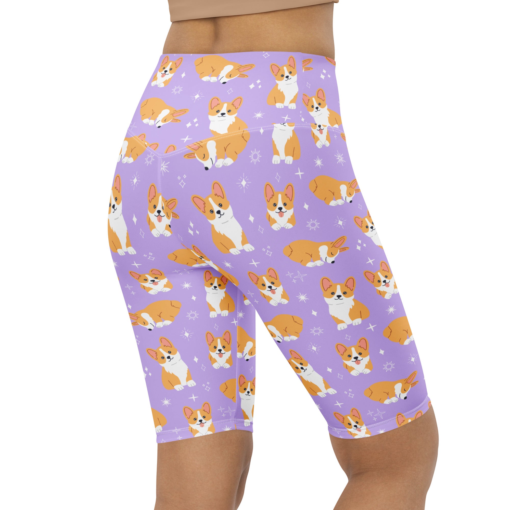 Women’s purple high waisted moisture wicking biker shorts with orange and white corgi dog pattern and star accents