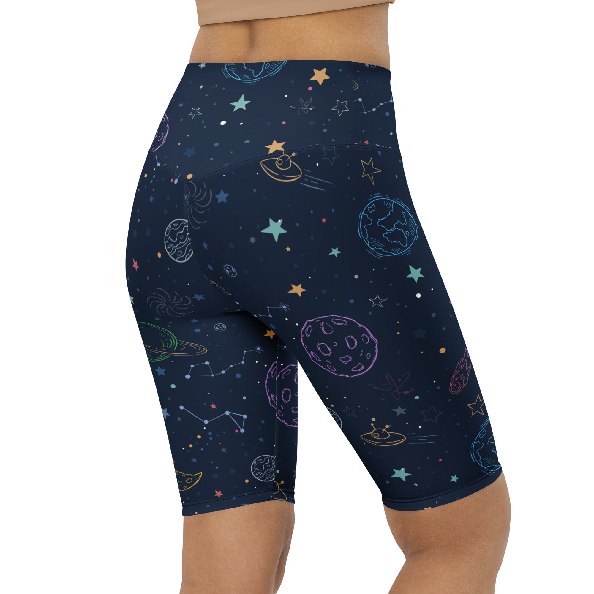 Women’s dark blue high waisted biker shorts with pastel planets stars and constellations moisture wicking fit