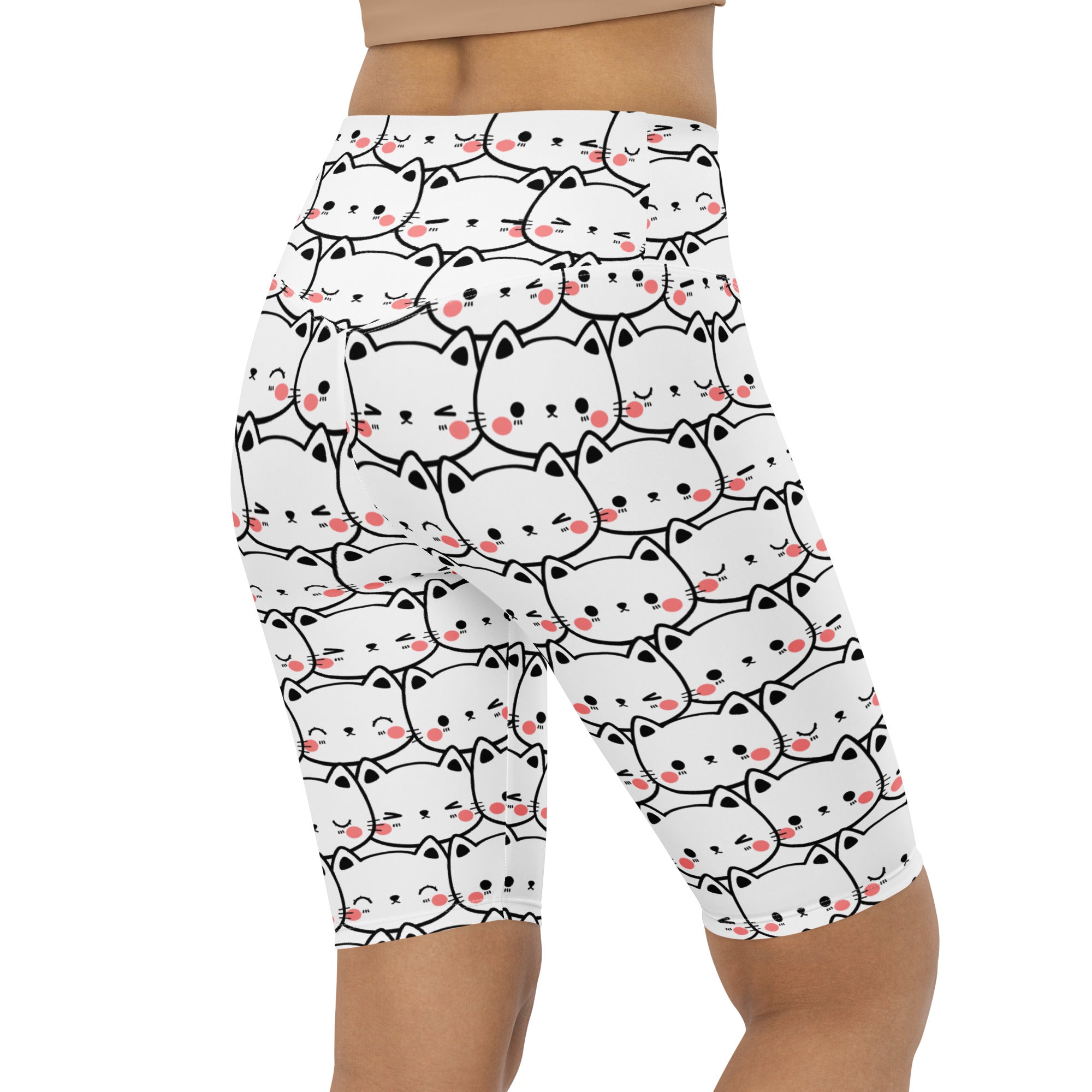 Women’s white high waisted moisture wicking bike shorts with black outlined cartoon cats and pink cheeks pattern