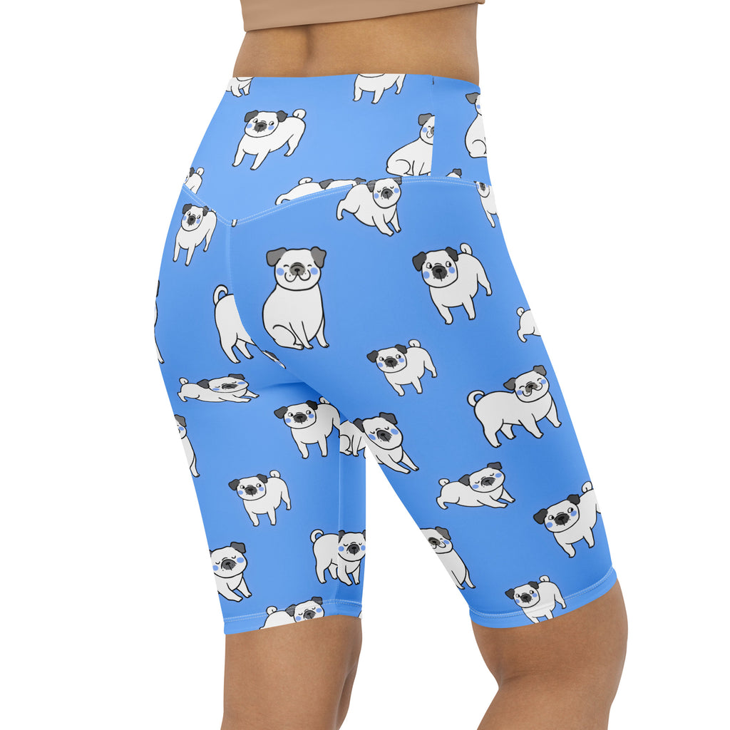 Women’s blue high waisted moisture wicking biker shorts with a playful cartoon pug pattern for active fit use
