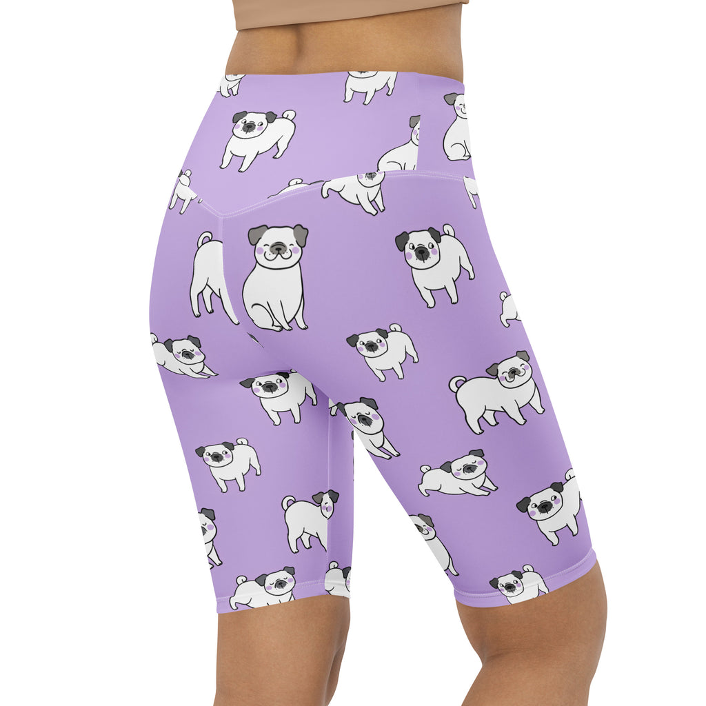 Women’s purple high waisted moisture wicking bike shorts with a playful white cartoon pug pattern