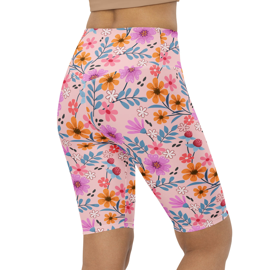Women’s pink floral high waisted biker shorts with orange purple and blue flowers moisture wicking active fit