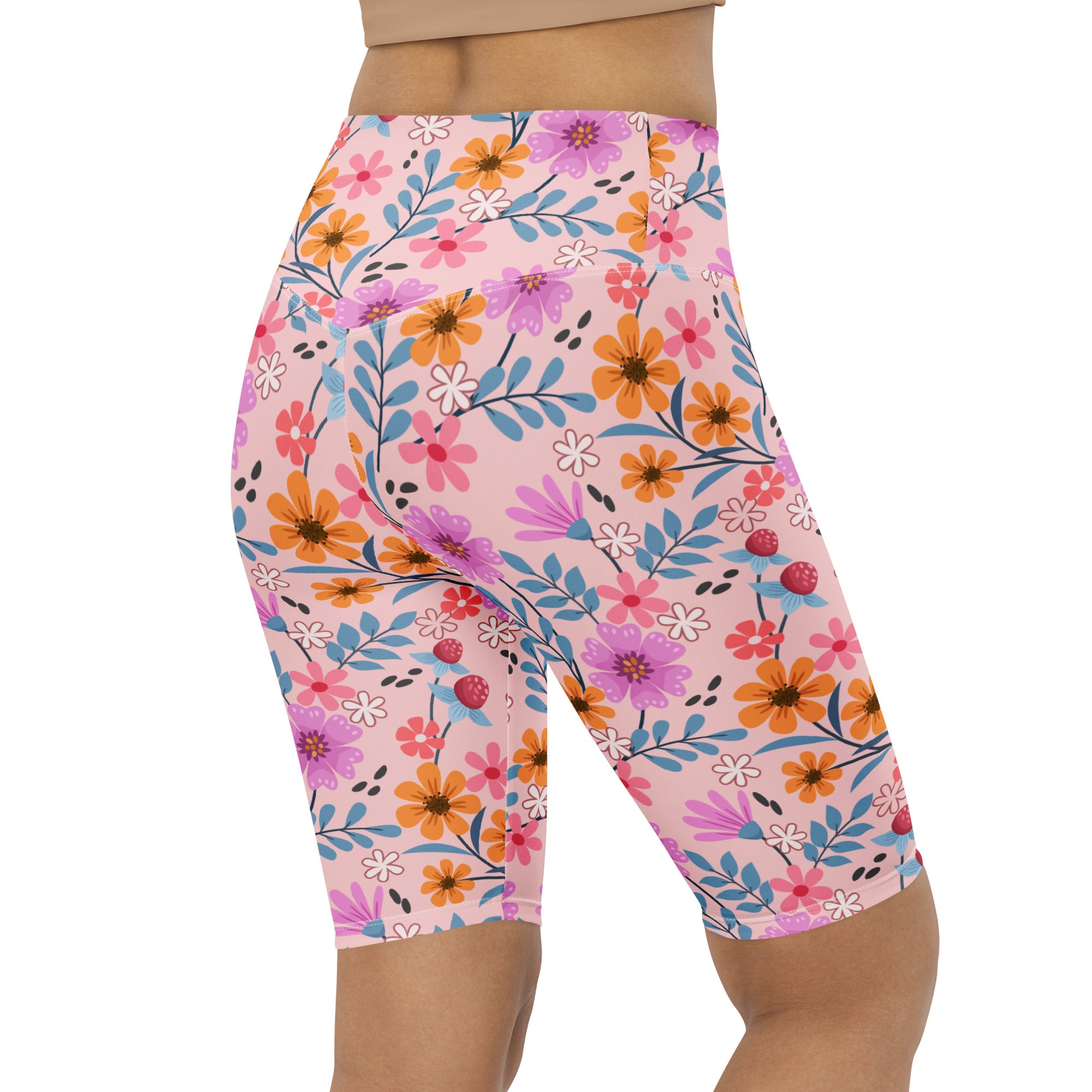 Women’s pink floral high waisted biker shorts with orange purple and blue flowers moisture wicking active fit