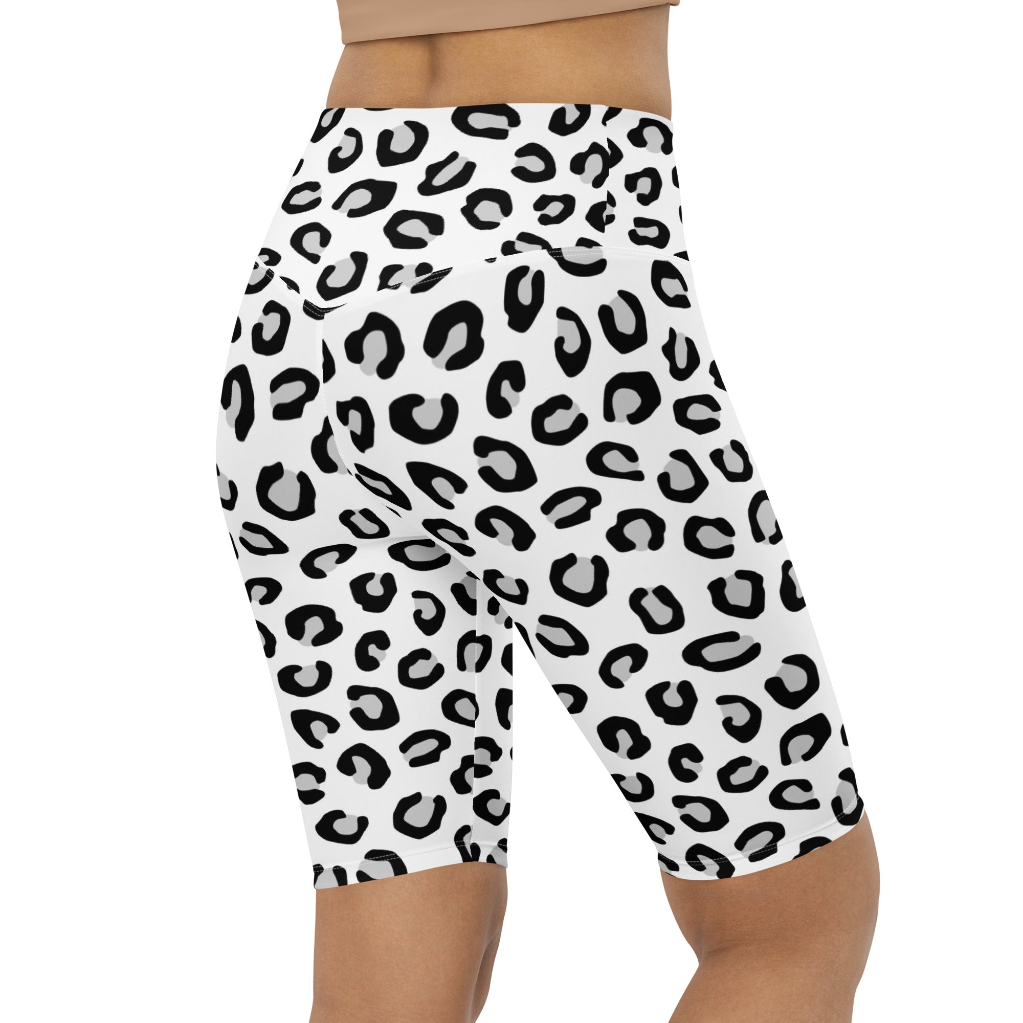 Women’s white high waisted bike shorts with bold black leopard print moisture wicking active fit