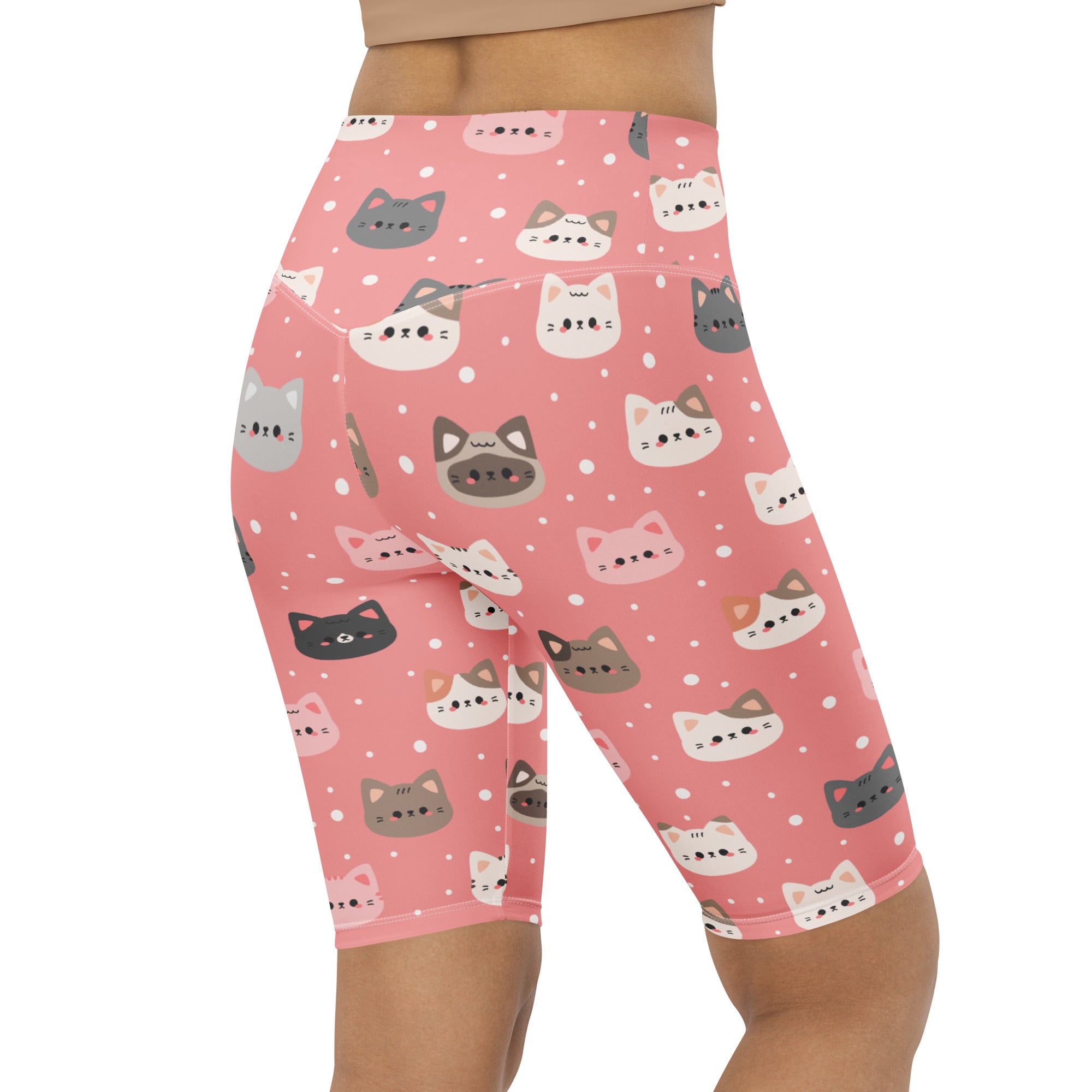 Pink cat faces high waisted biker shorts with moisture wicking fabric and playful gray white and black cartoon cats on pink