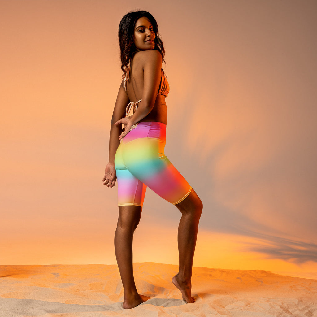Women’s bright rainbow high waisted biker shorts in smooth stretchy fabric with moisture wicking active fit