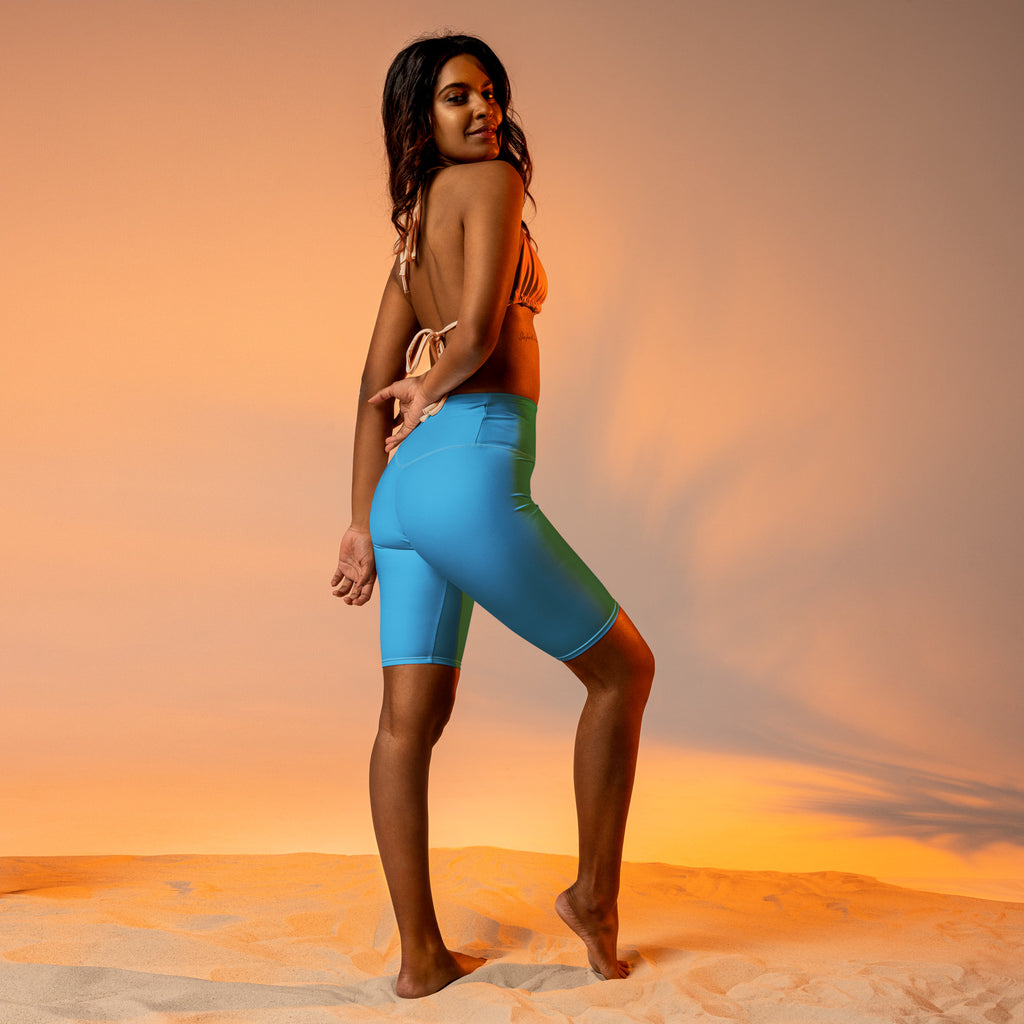 Bright blue high waisted biker shorts in smooth stretch fabric designed for moisture wicking and active fit
