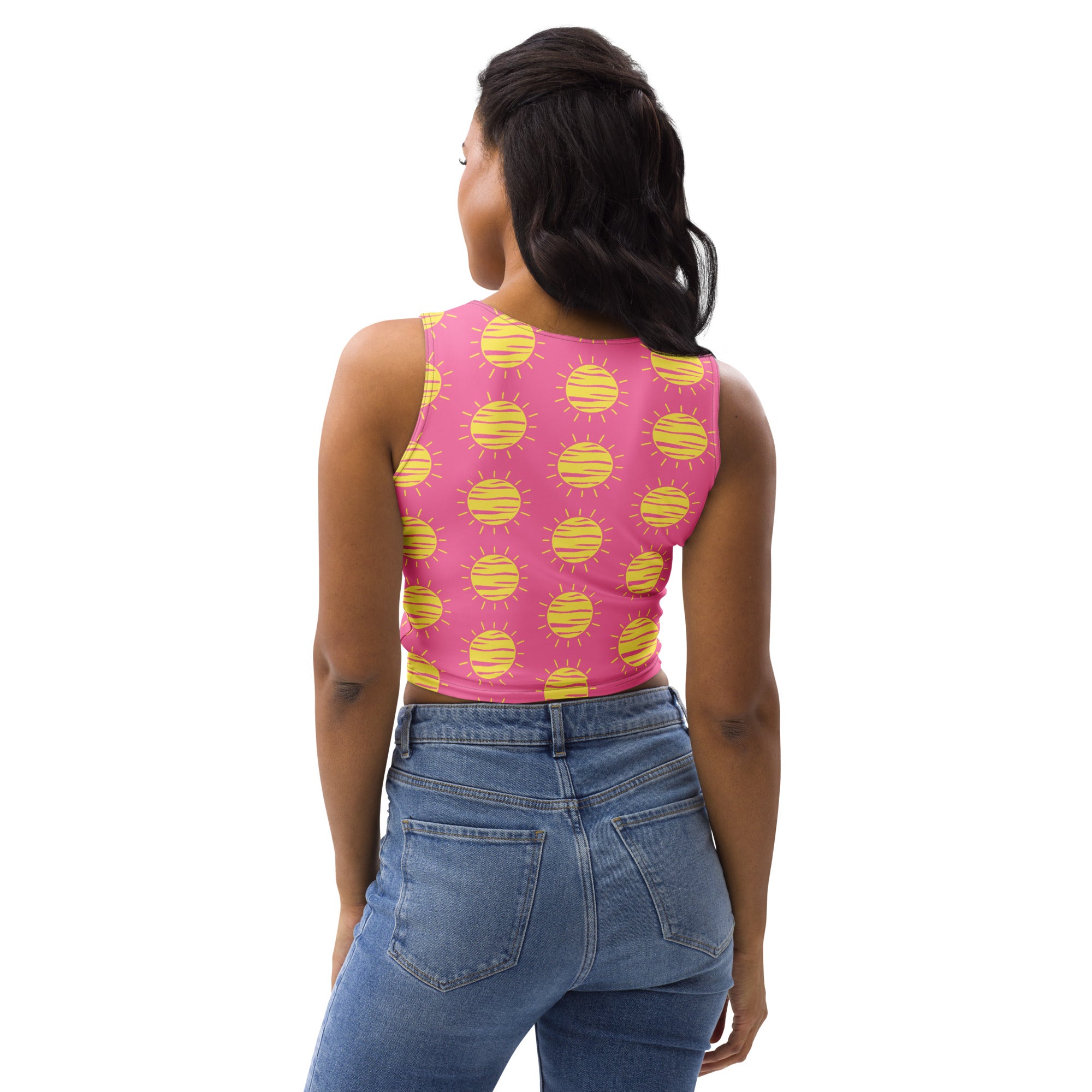 Women’s pink sleeveless buttery soft crop top with yellow sun print perfect for sunny casual wear