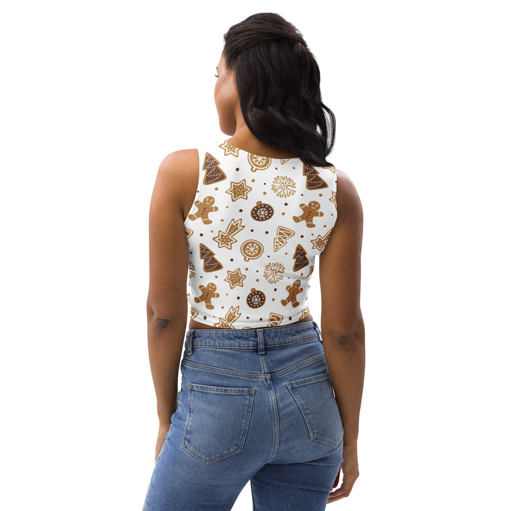 White sleeveless buttery soft crop top with festive gingerbread men christmas trees stars and ornaments pattern