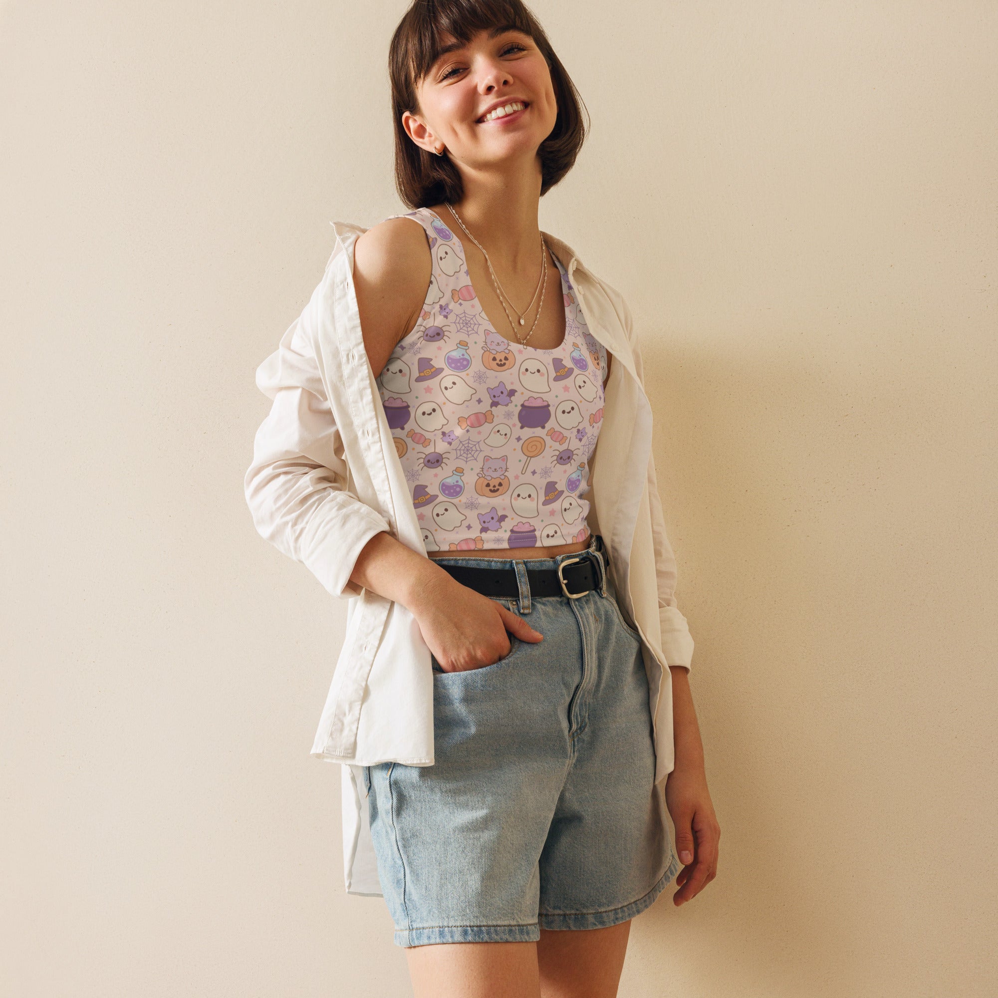 Women’s pastel halloween buttery soft crop top in lavender and white with cute ghost pumpkin and witch designs