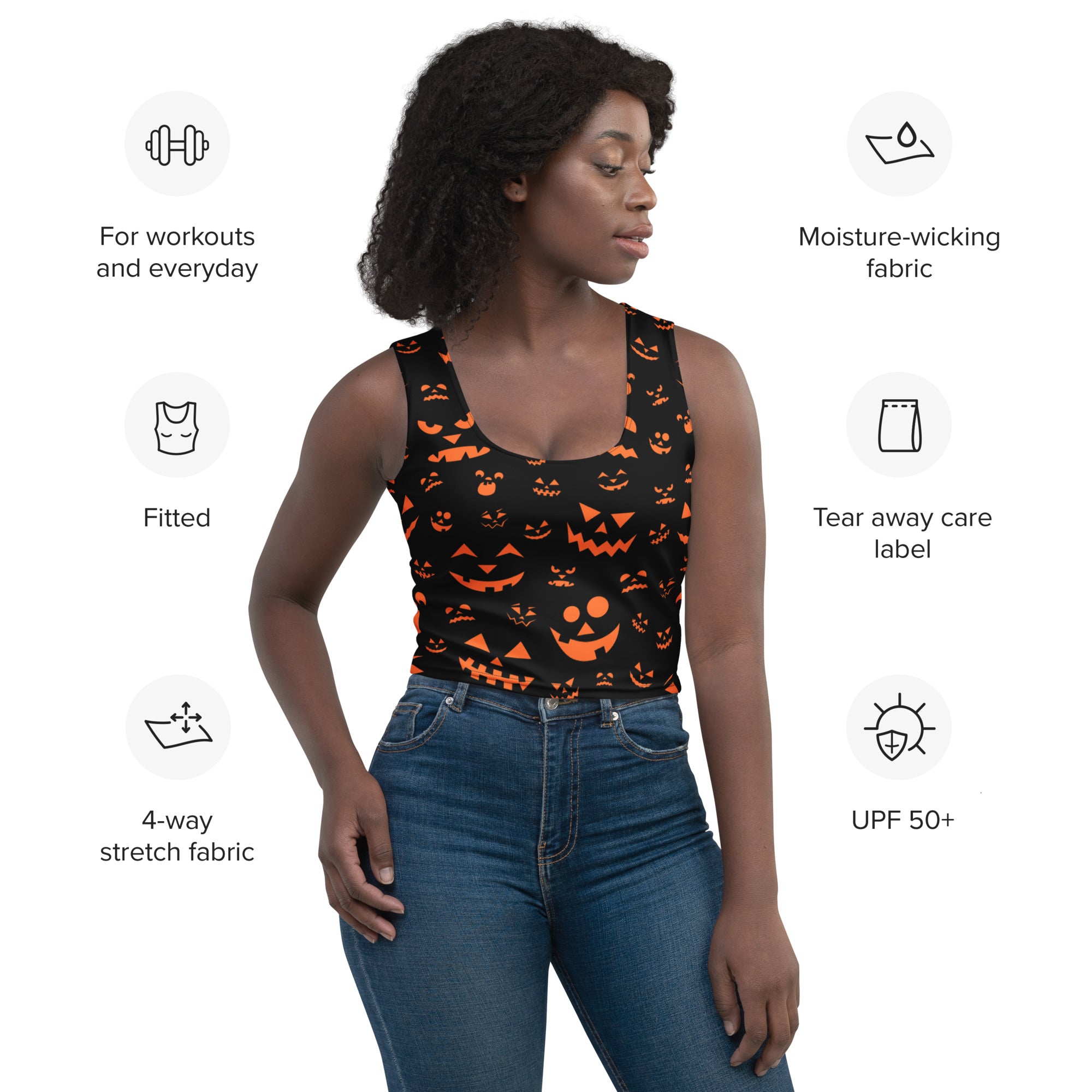 Women’s orange jack-o’-lantern Halloween tank top with buttery soft black fabric and orange pumpkin faces printed