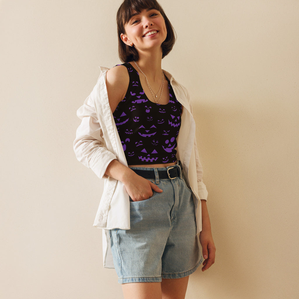 Women’s purple jack-o-lantern halloween buttery soft crop top with black and purple pumpkin faced design