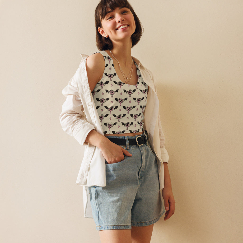 White off-the-shoulder crop top with black eye and bat pattern made of buttery soft fabric for gothic halloween style