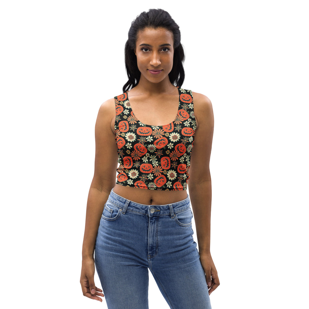 Women’s buttery soft black crop top with orange jack o lanterns and white flowers for vintage halloween style