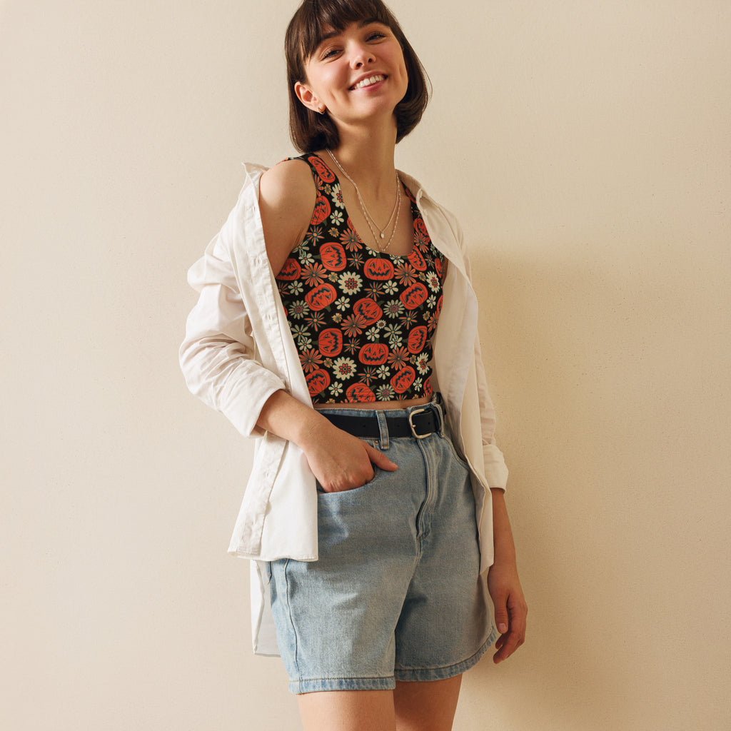 Women’s buttery soft black crop top with orange pumpkin and vintage floral patterns for halloween wear
