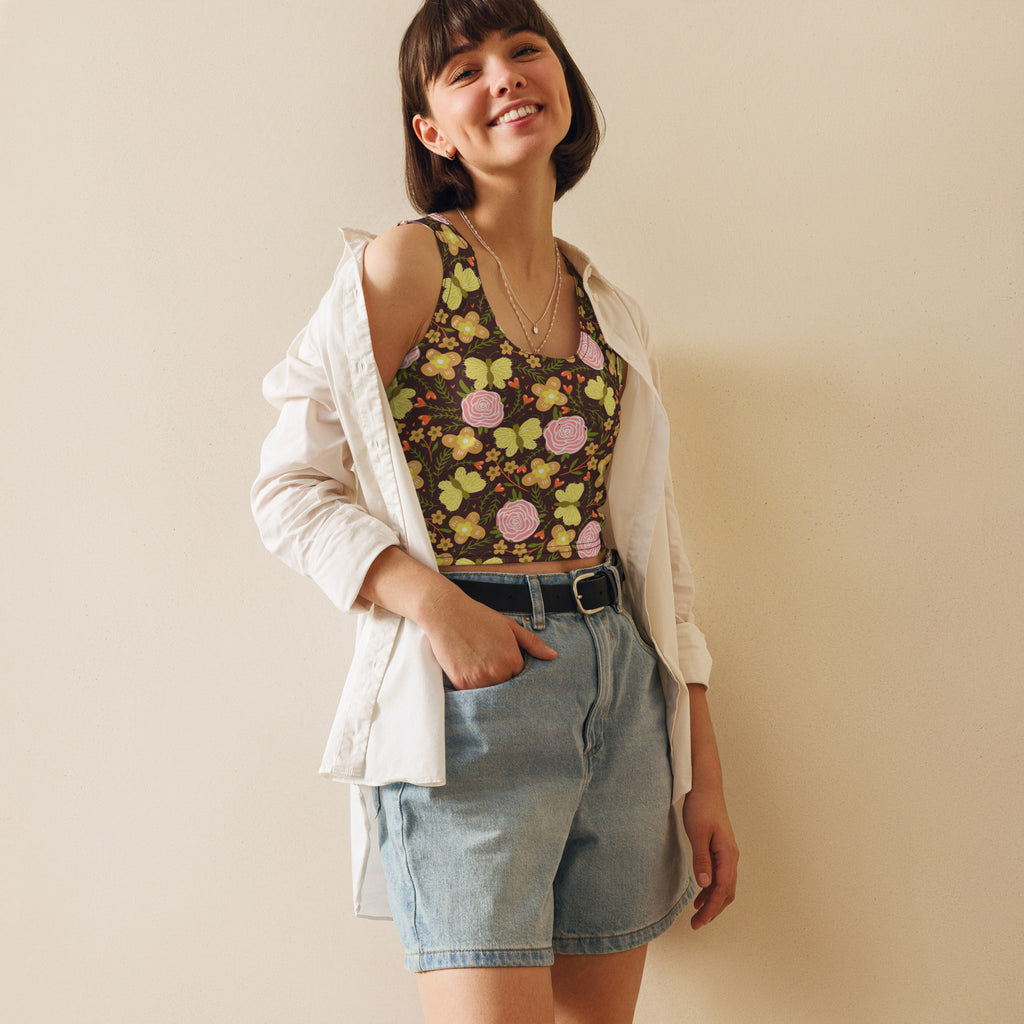 Women’s retro floral buttery soft crop top with pink yellow roses on dark brown worn over white button-up shirt