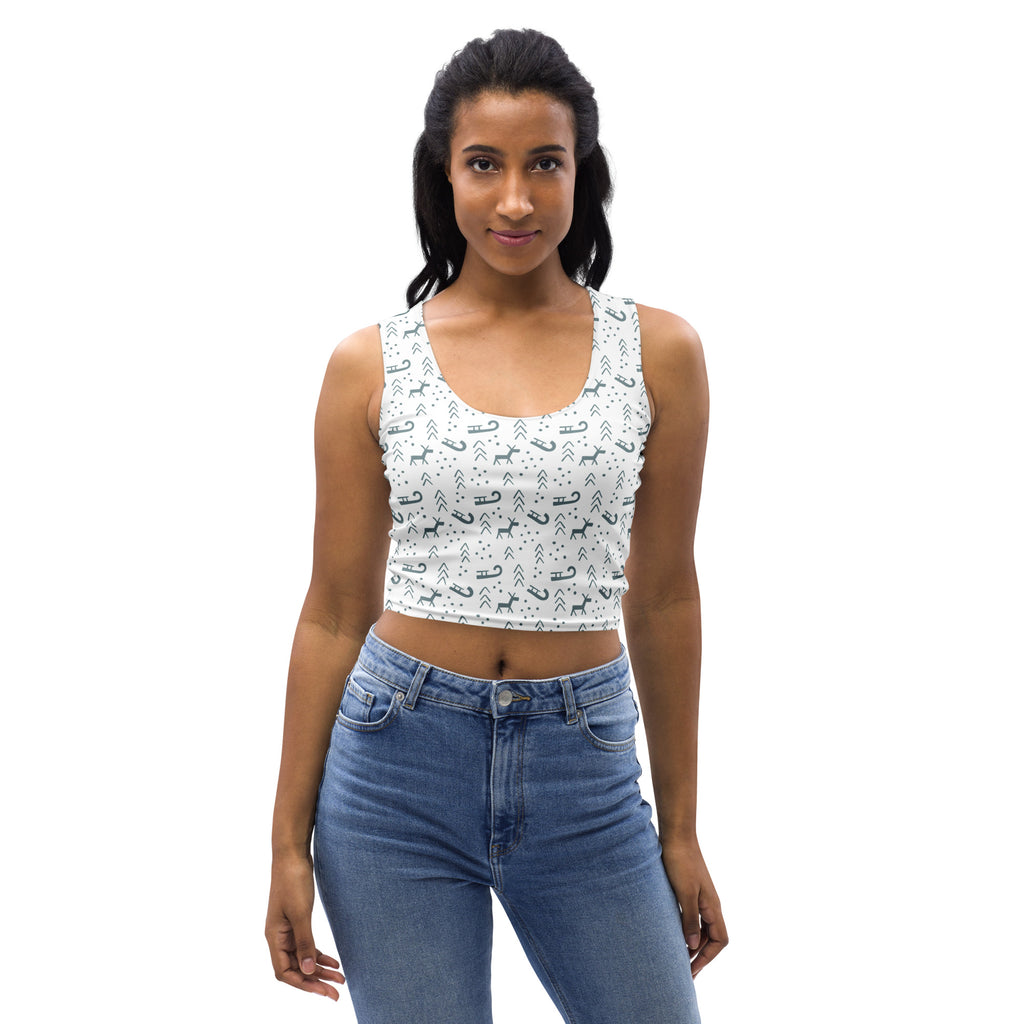 Women’s white buttery soft crop top with black reindeer sleigh and arrow holiday patterns for christmas wear