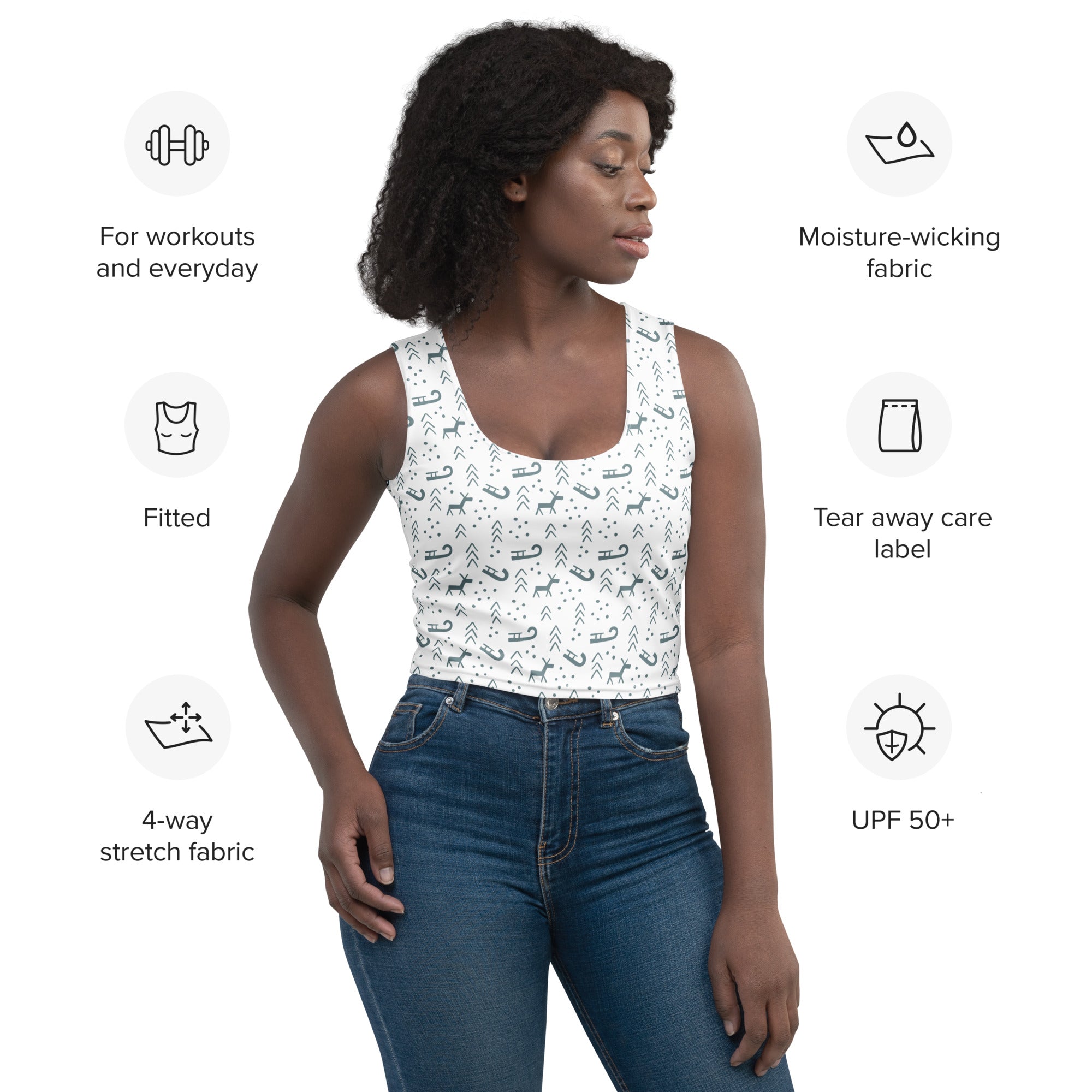 White buttery soft crop top with black and gray reindeer sleigh and arrow patterns for women