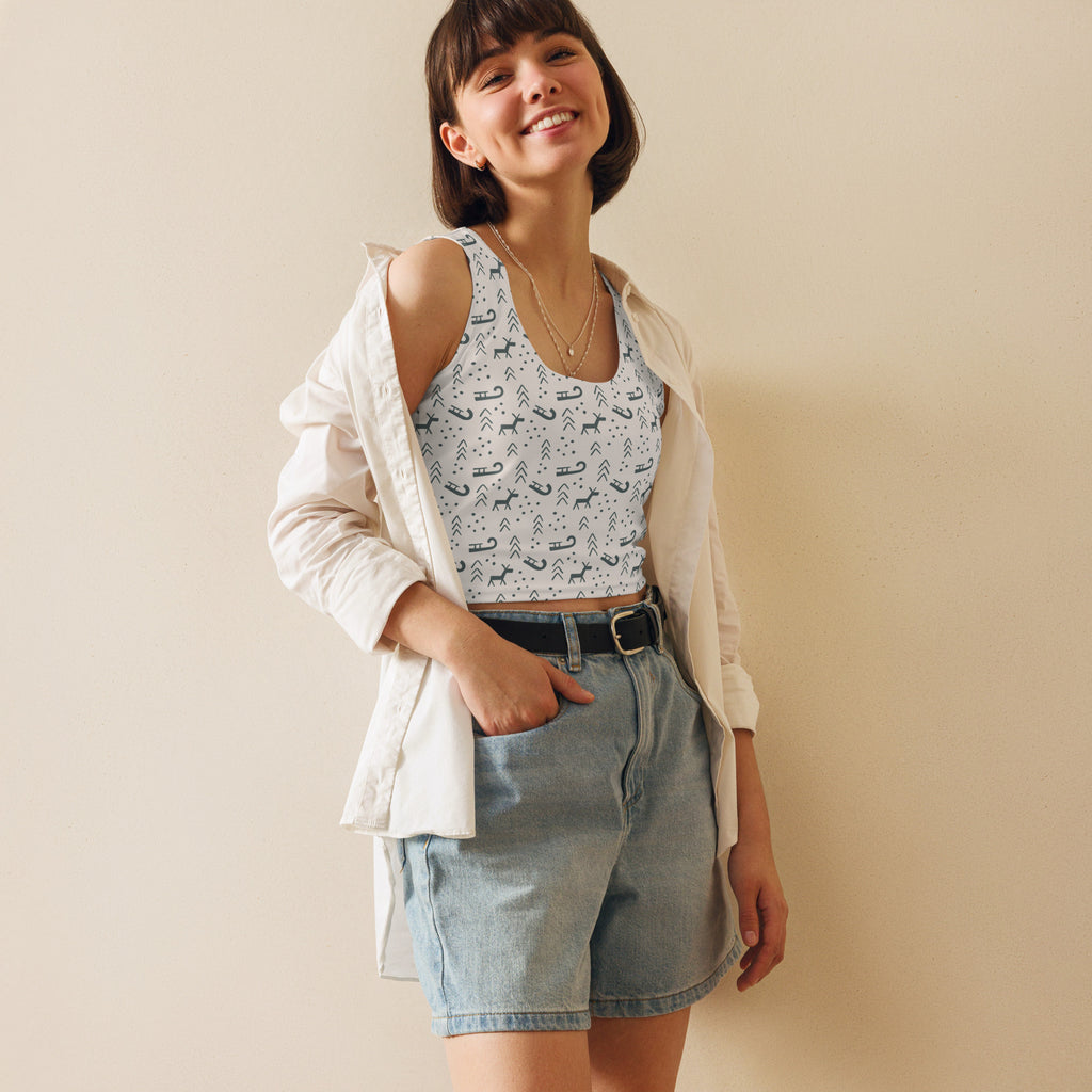 Light blue denim shorts with black belt and silver buckle paired with women’s reindeer and sleighs Christmas buttery soft crop top