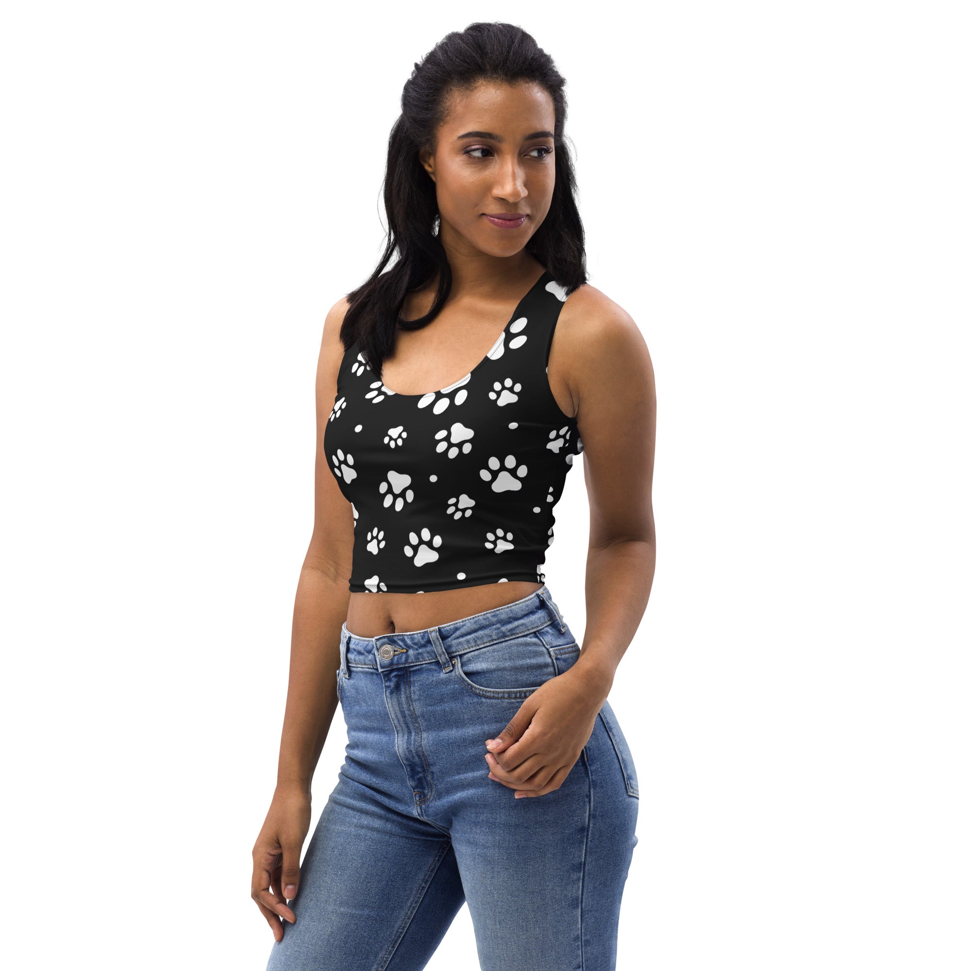 Black buttery soft women’s crop top with white paw print pattern perfect for casual wear
