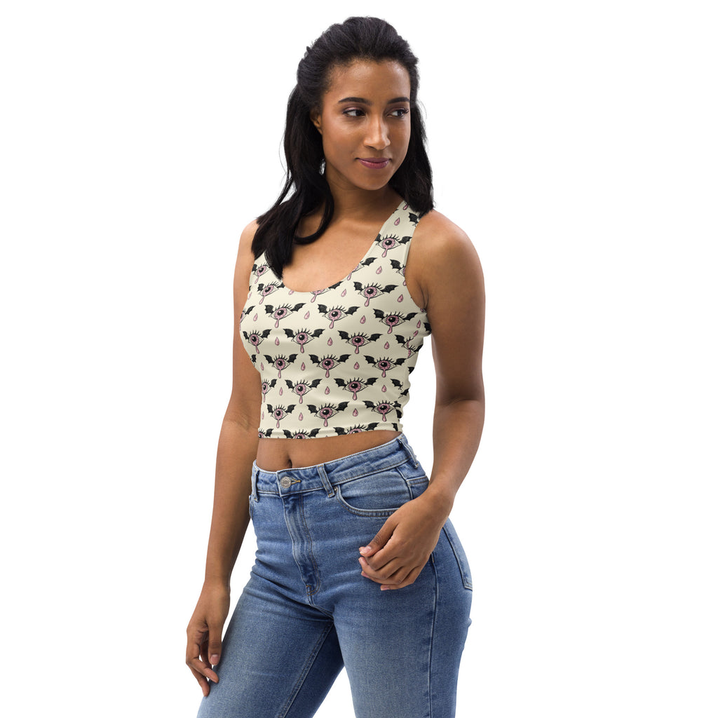 Cream-colored buttery soft cropped tank top with black bats eyes and teardrop pattern for gothic halloween style