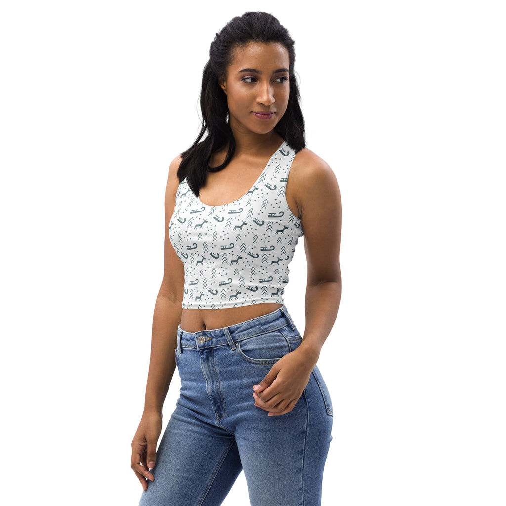 White buttery soft cropped tank top with black reindeer and sleigh patterns for women’s christmas wear
