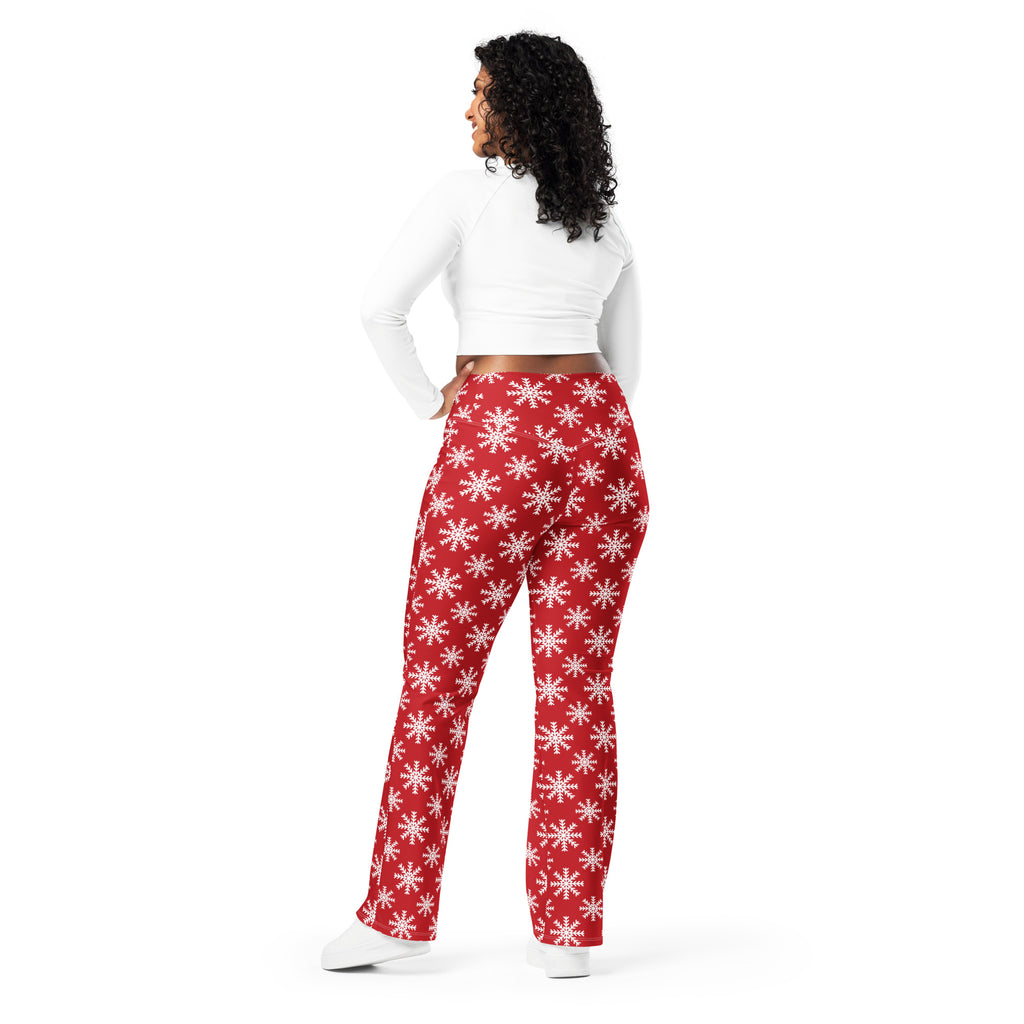 Women’s red high waist flare legging pants with white snowflake pattern perfect for winter wear