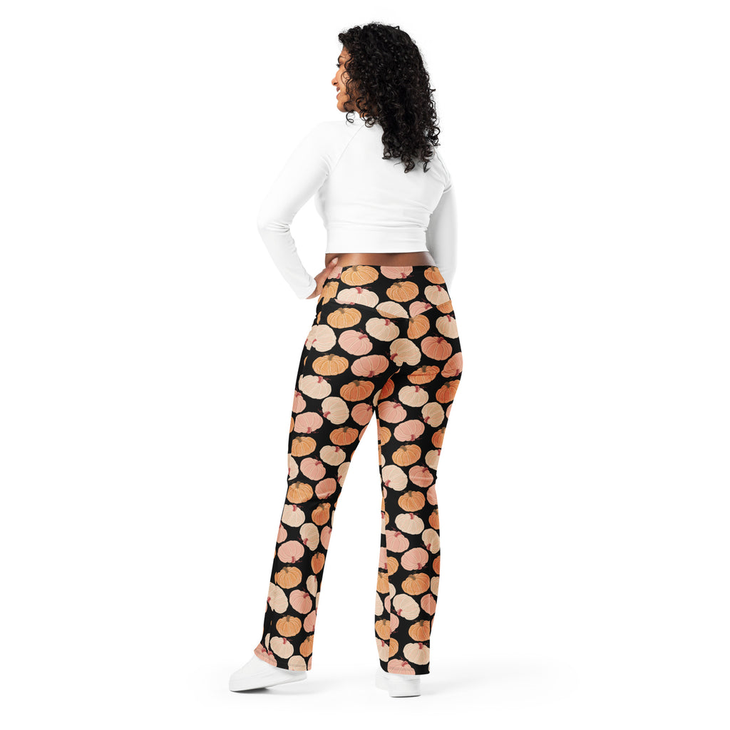 Women’s black high waist flare leggings with orange and beige pumpkin pattern for fall and casual wear