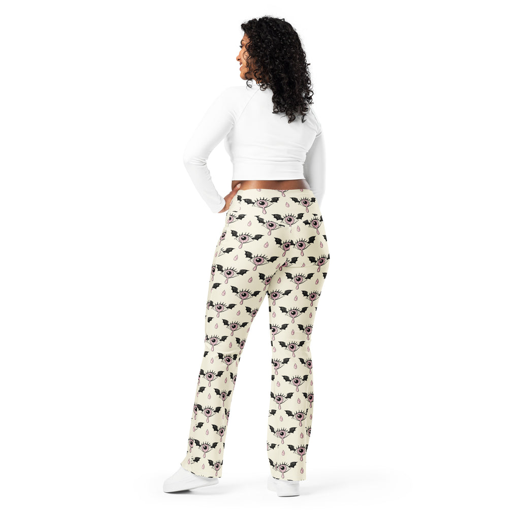 Women’s cream-colored gothic eyeball bat high waist flare leggings with black winged eyes and teardrop pattern