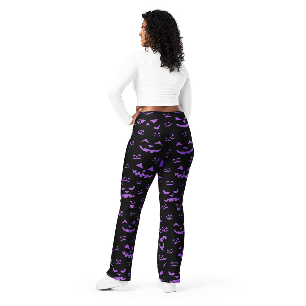 Women’s black high waist flare leggings with vibrant purple jack o lantern halloween pattern