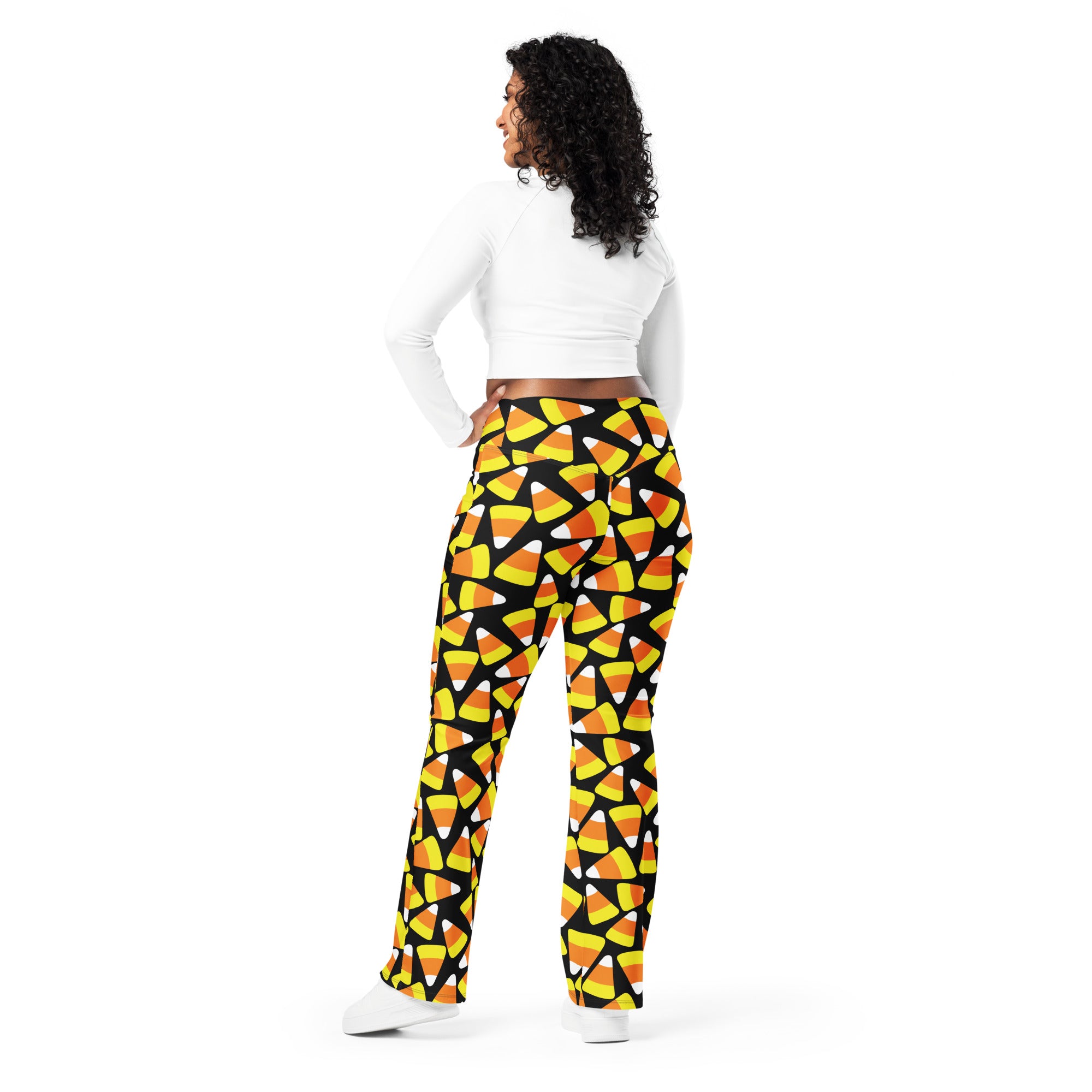 Women’s candy corn high waist flare leggings in black with vibrant yellow orange and white candy corn pattern