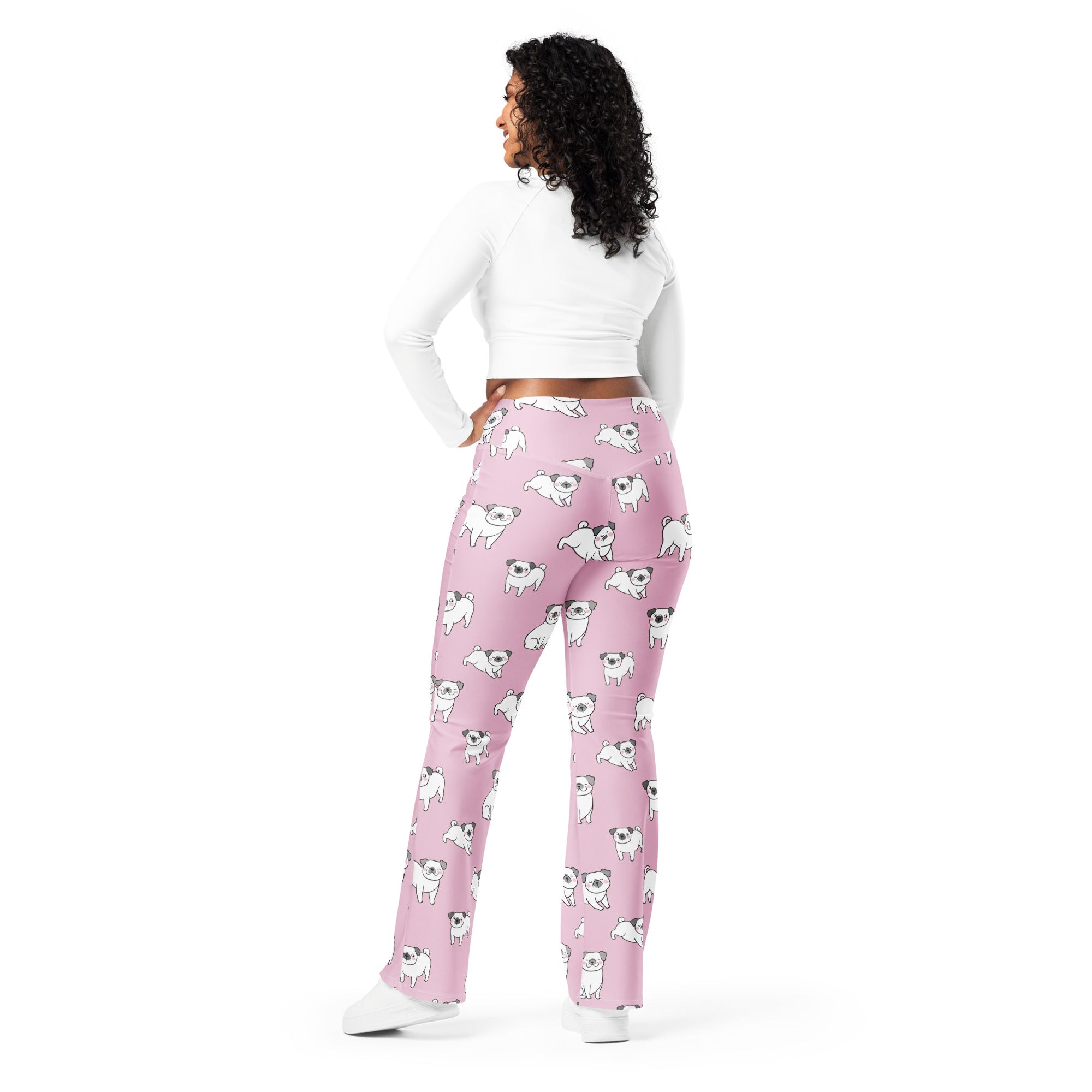Women pink high waist flare legging pants featuring playful white pug dog pattern on soft pajama fabric