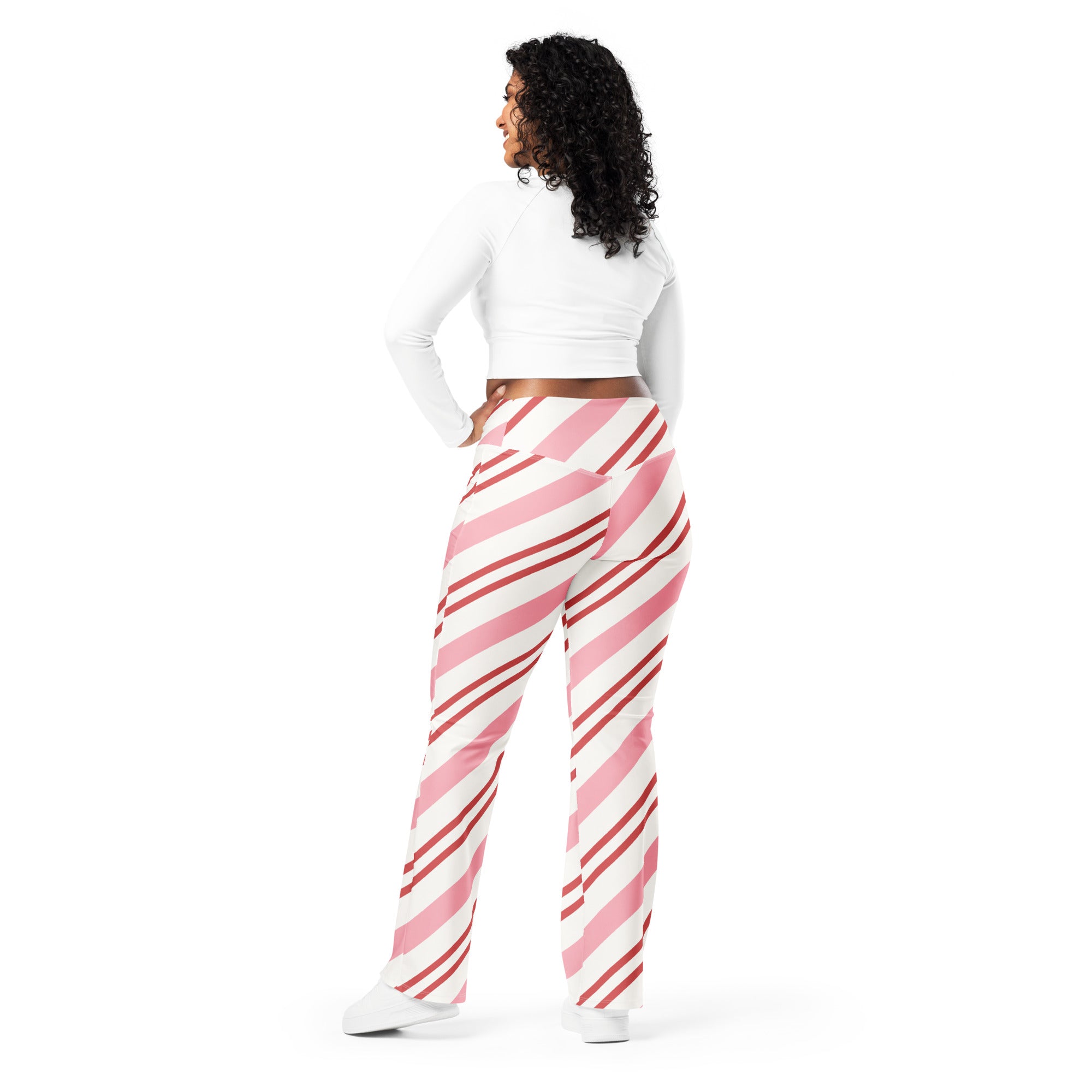 Women’s pink candy cane stripes high waist flare leggings with snug fit and pink and white diagonal stripes