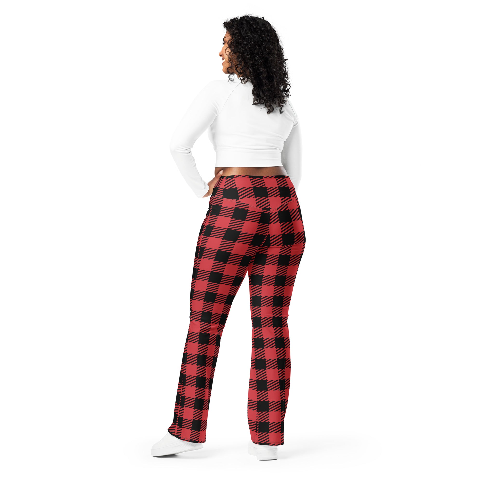 Women’s red buffalo plaid high waist flare legging pants in red and black plaid pattern shown from the back side