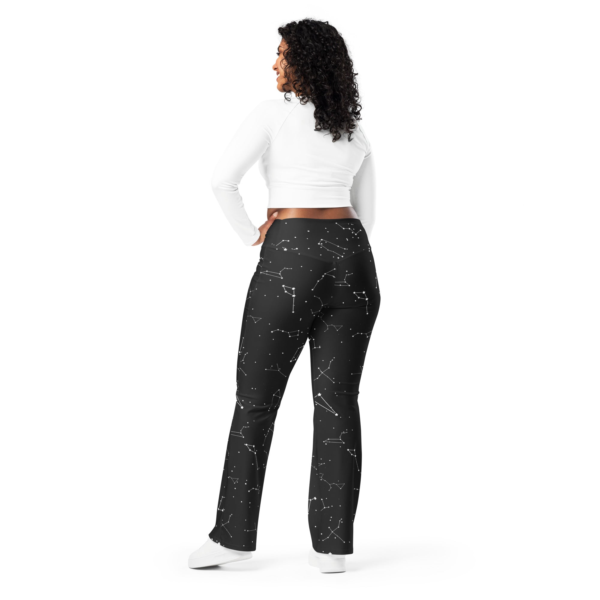 Women’s black high waist flare leggings with white realistic constellation outlines and scattered star patterns