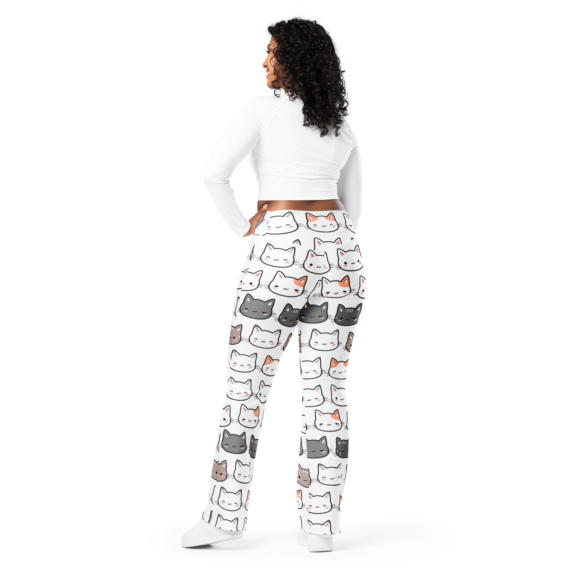 White pajama pants with high waist flare legging style featuring a playful multicolor cartoon cat print